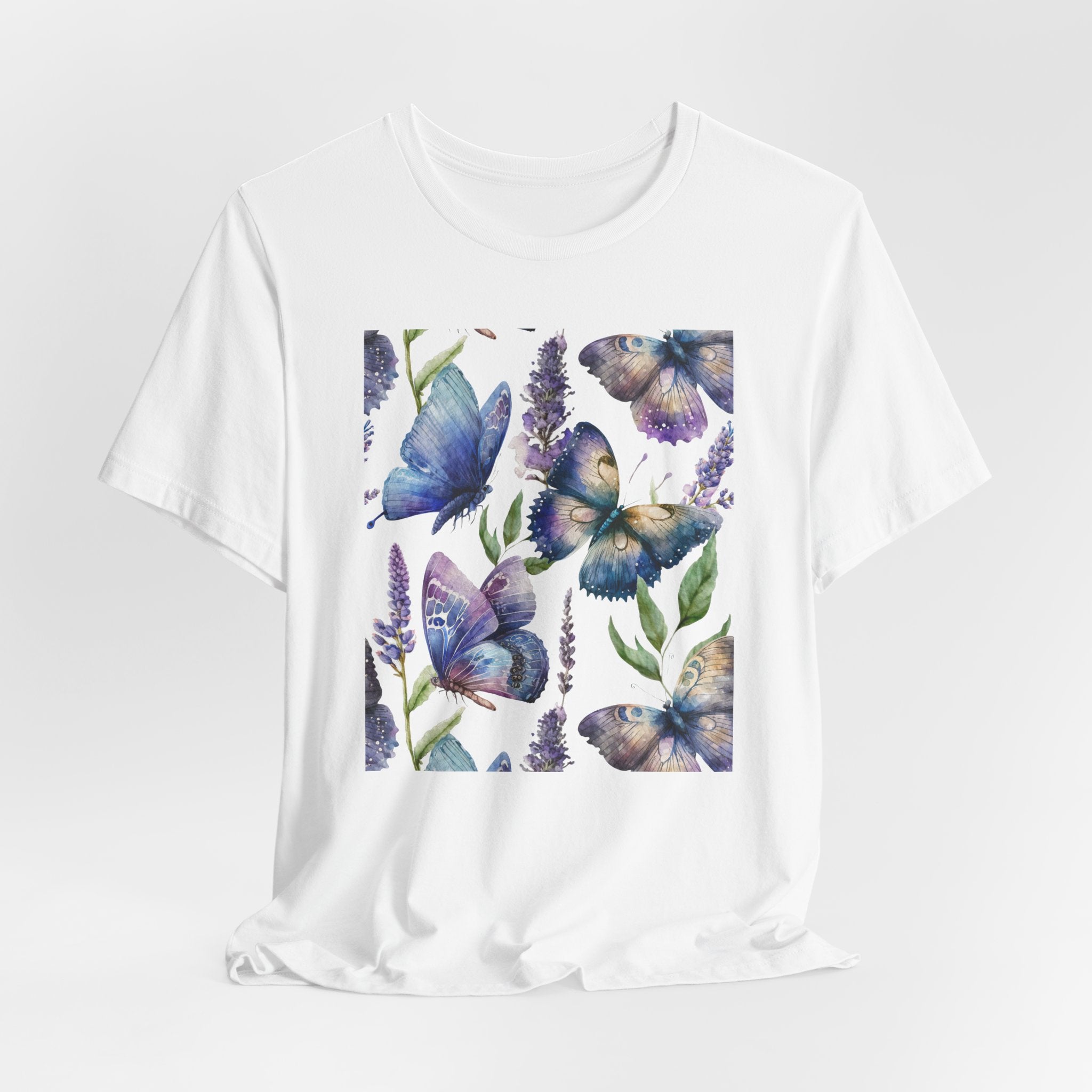 White t-shirt with blue butterfly and lavender design on a white background