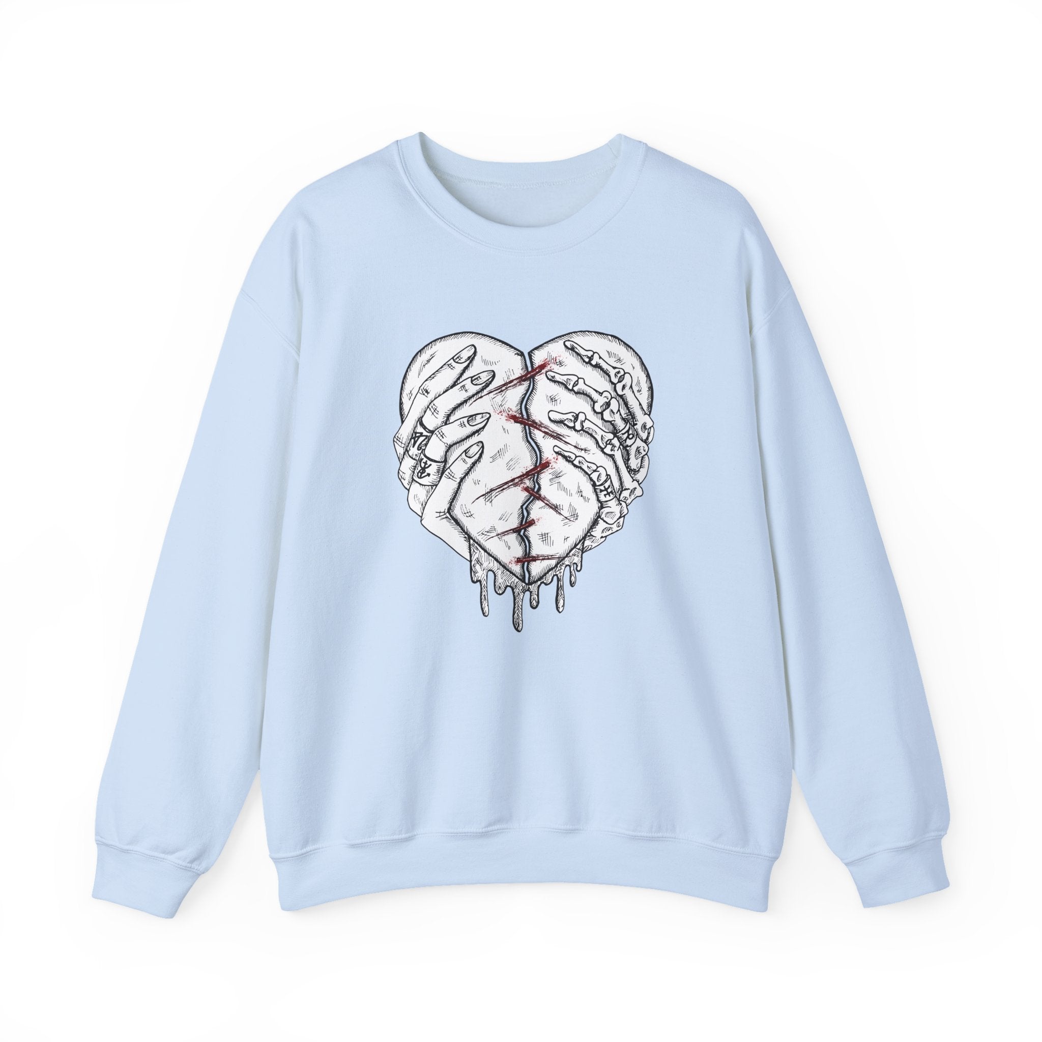 Light blue sweatshirt with a graphic design of a broken heart on a white background