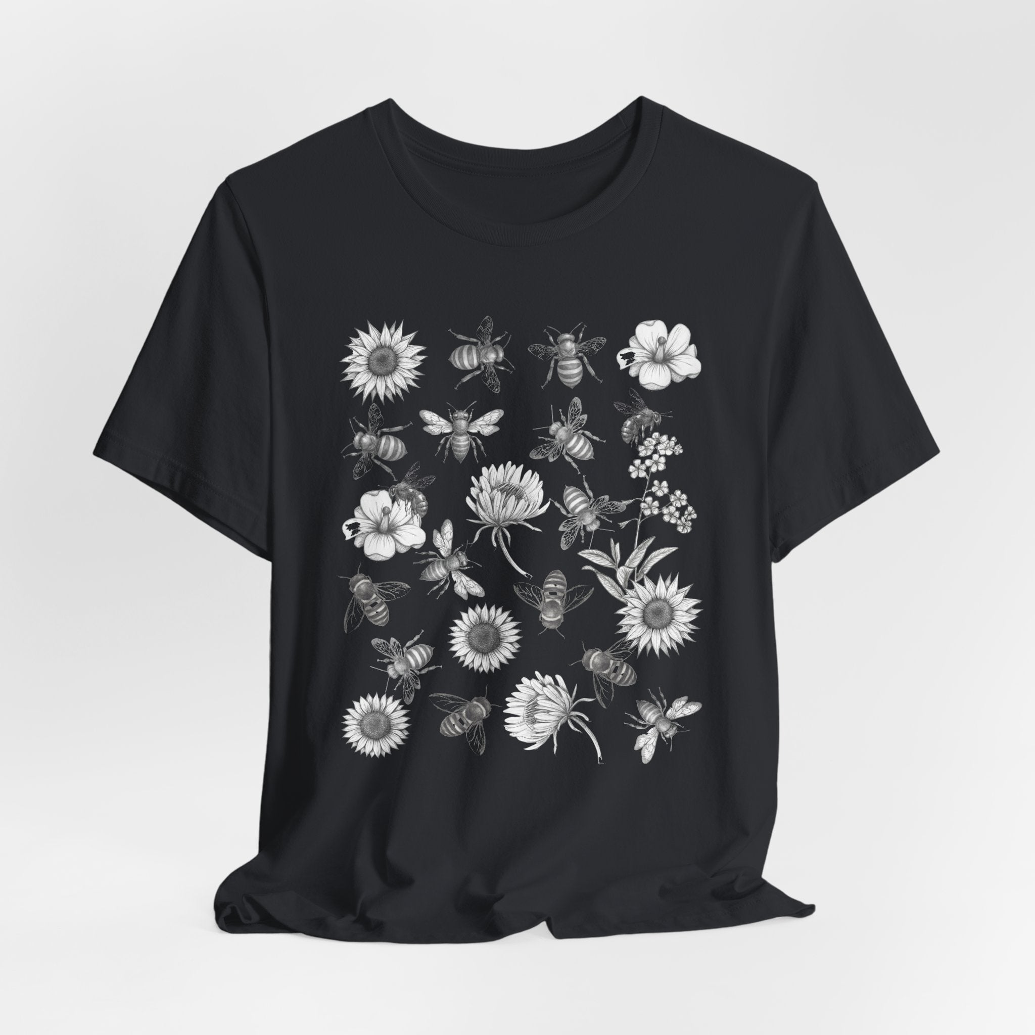 Black t-shirt with white graphic design on a light gray background