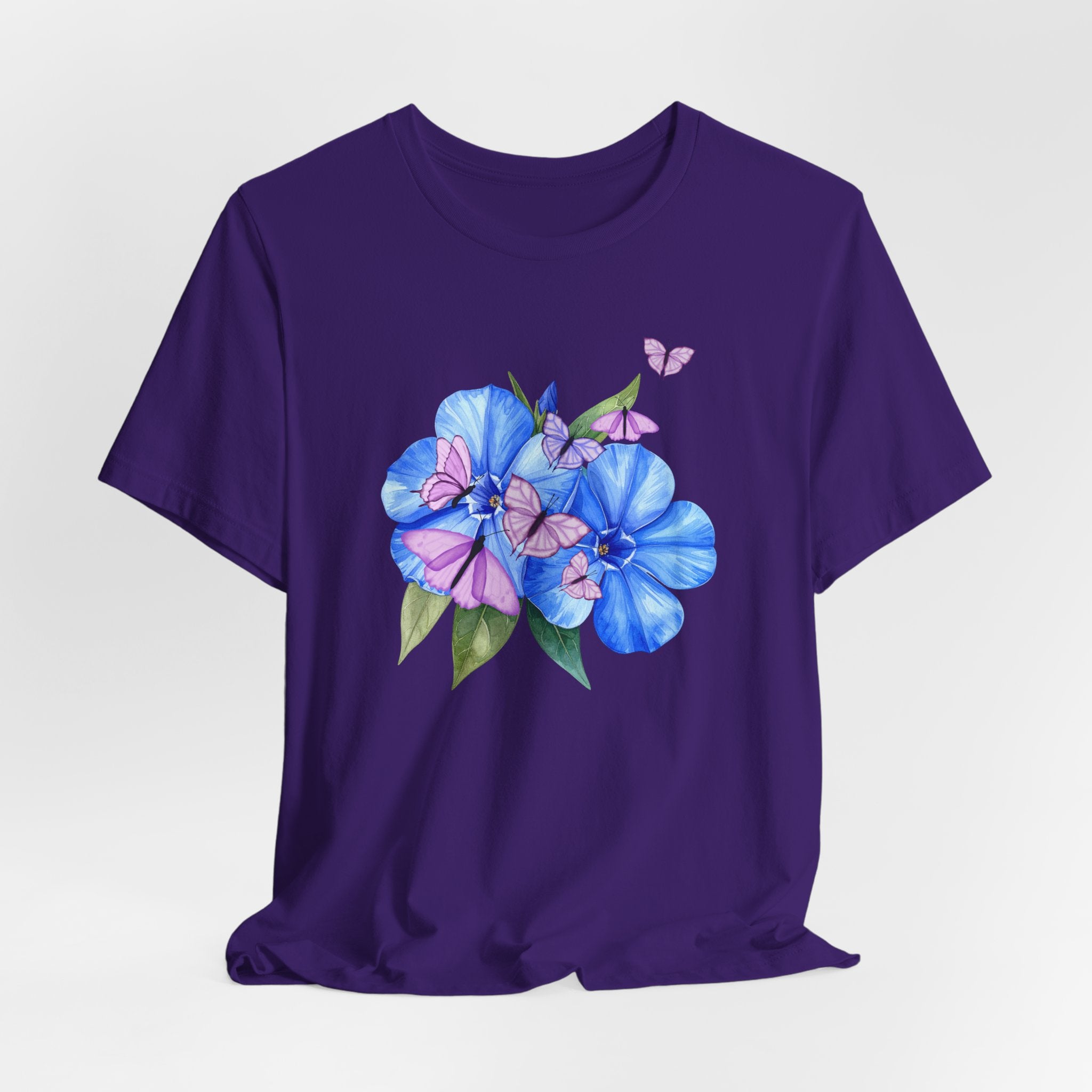 Purple t-shirt with blue floral design on a white background