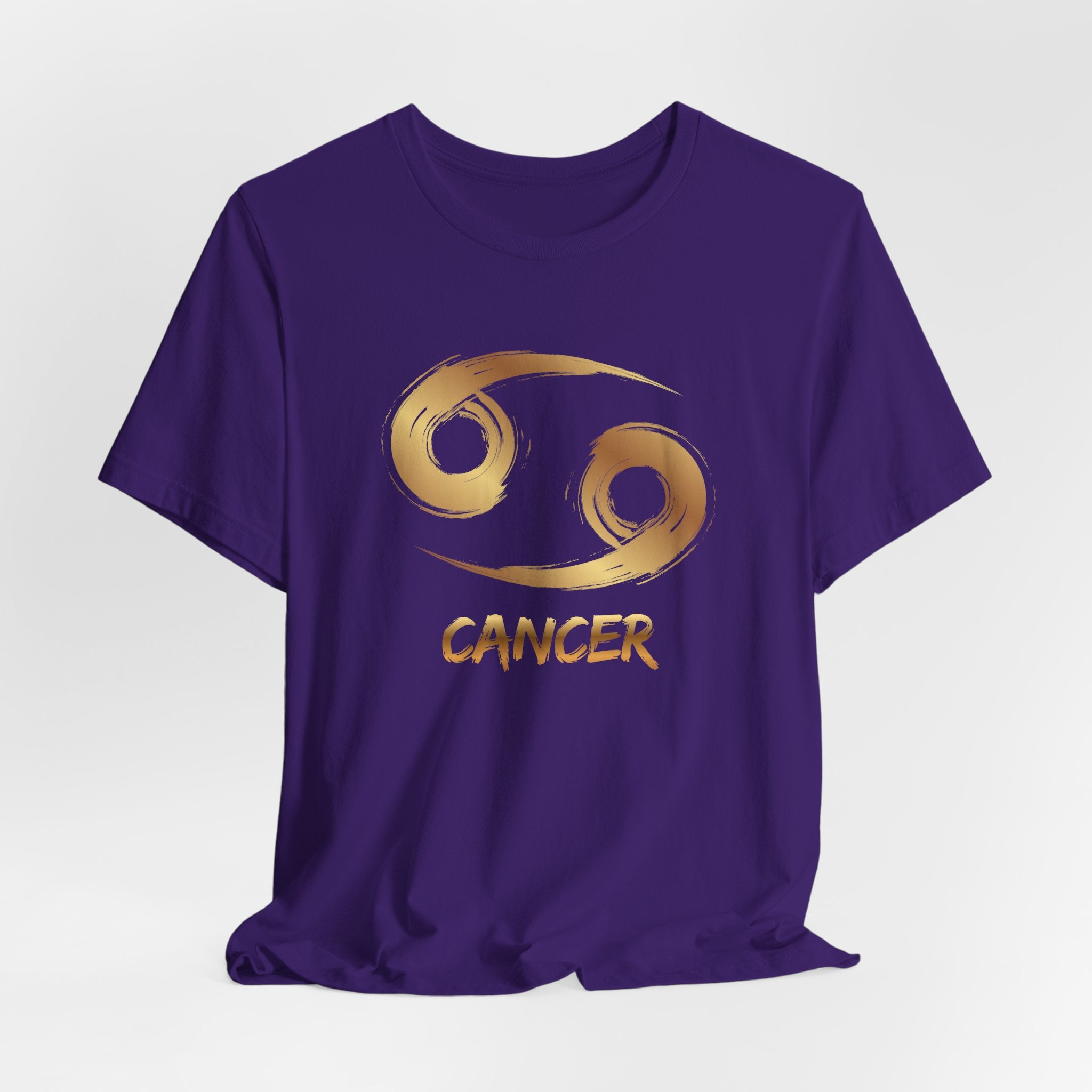 Purple t-shirt with gold Cancer zodiac symbol on a white background