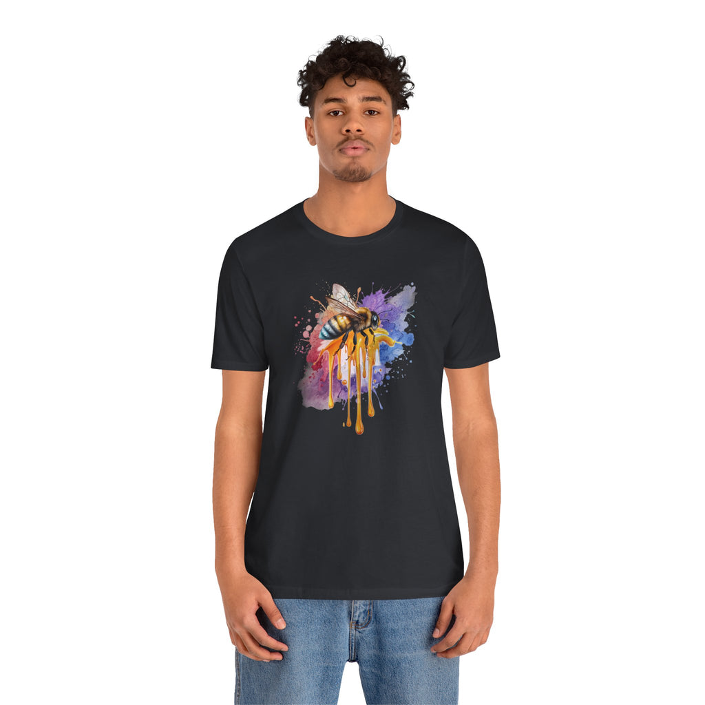 Person wearing a black t-shirt with a colorful bee design on a white background