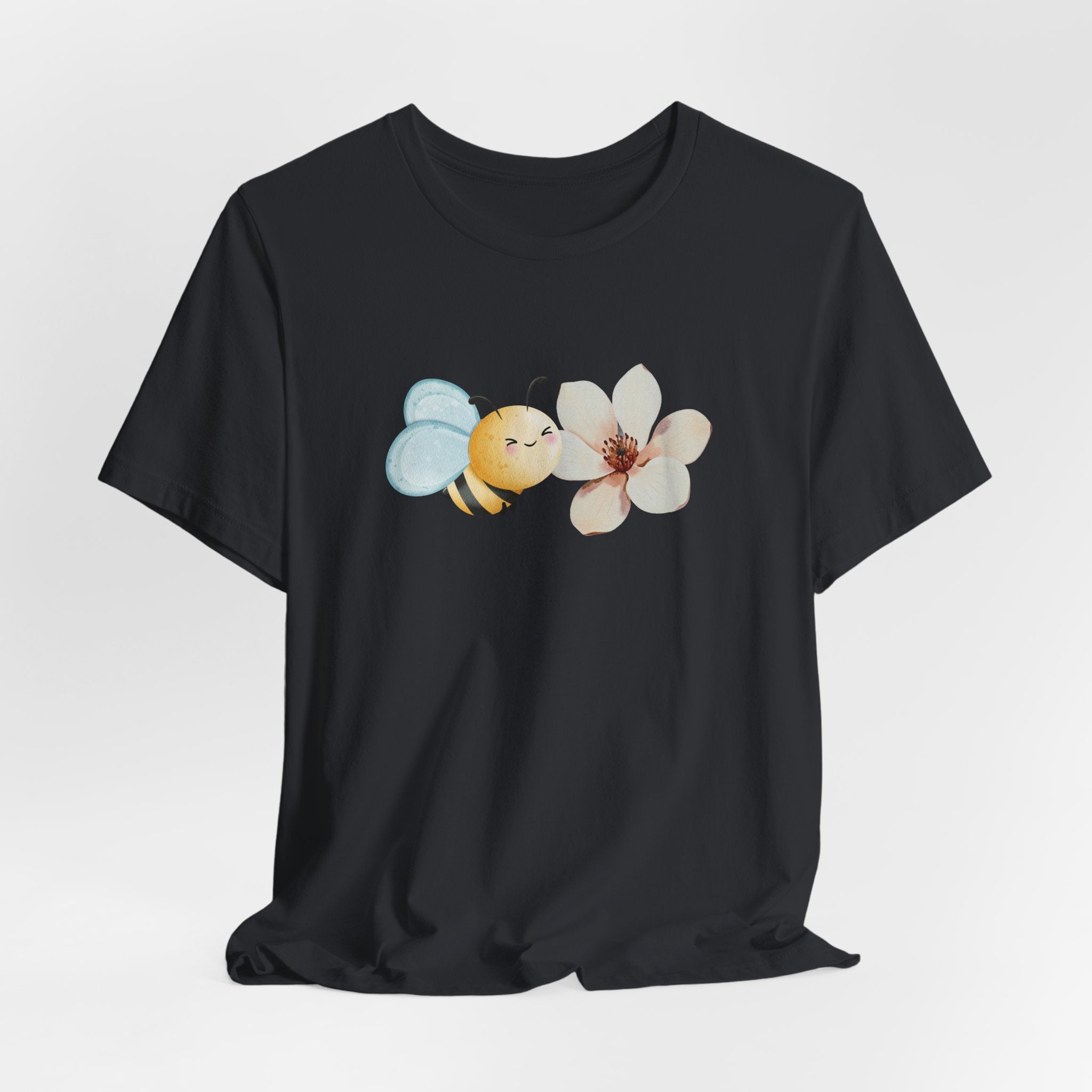 Black t-shirt with a bee and flower graphic on a white background