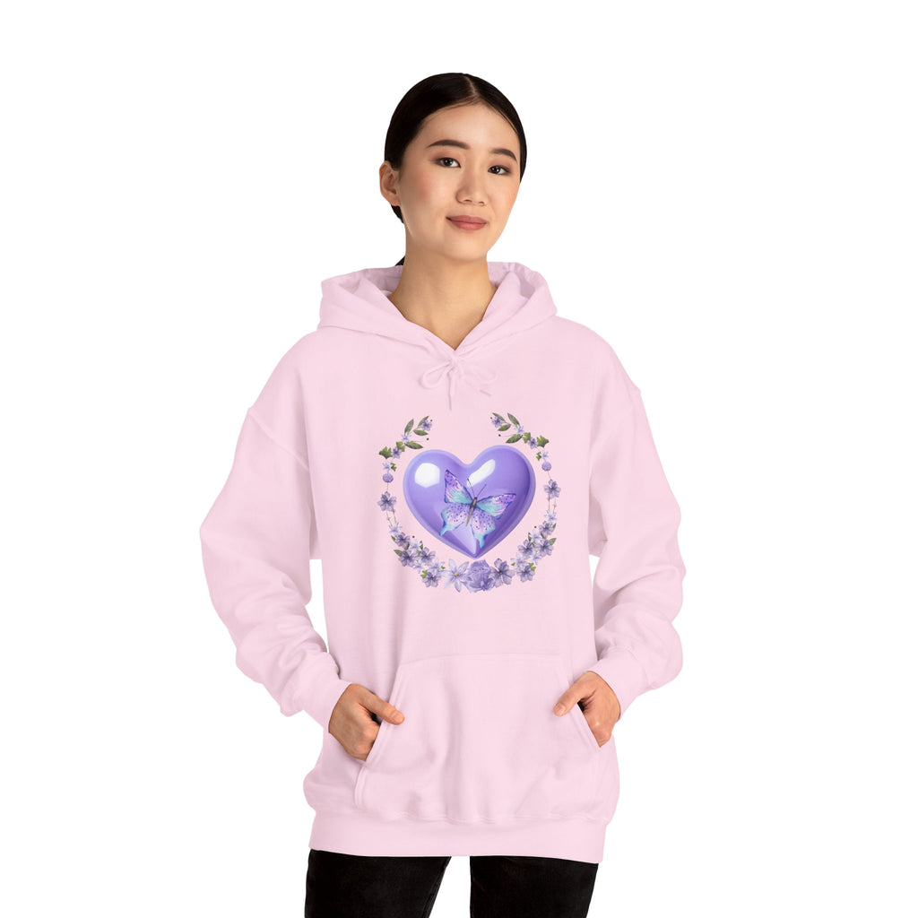 Person wearing a pink hoodie with a purple heart design on a white background