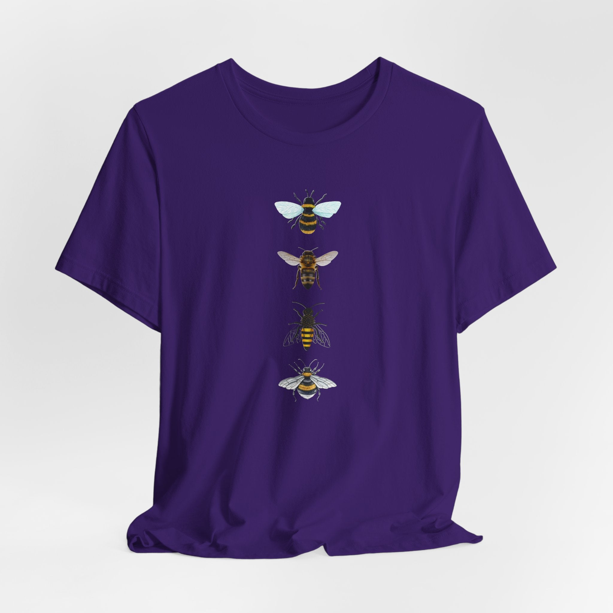 Purple t-shirt with bee illustrations on a white background