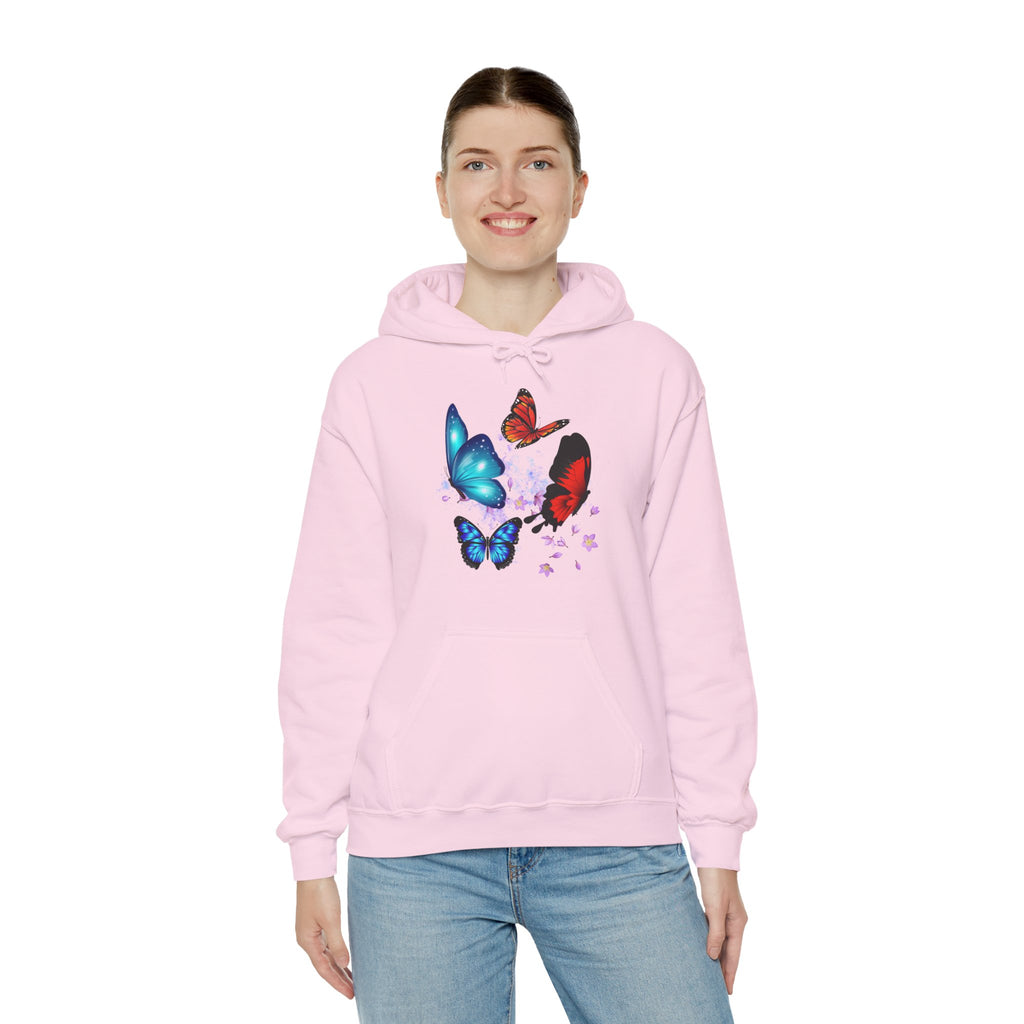 Person wearing a pink hoodie with butterfly designs on a white background
