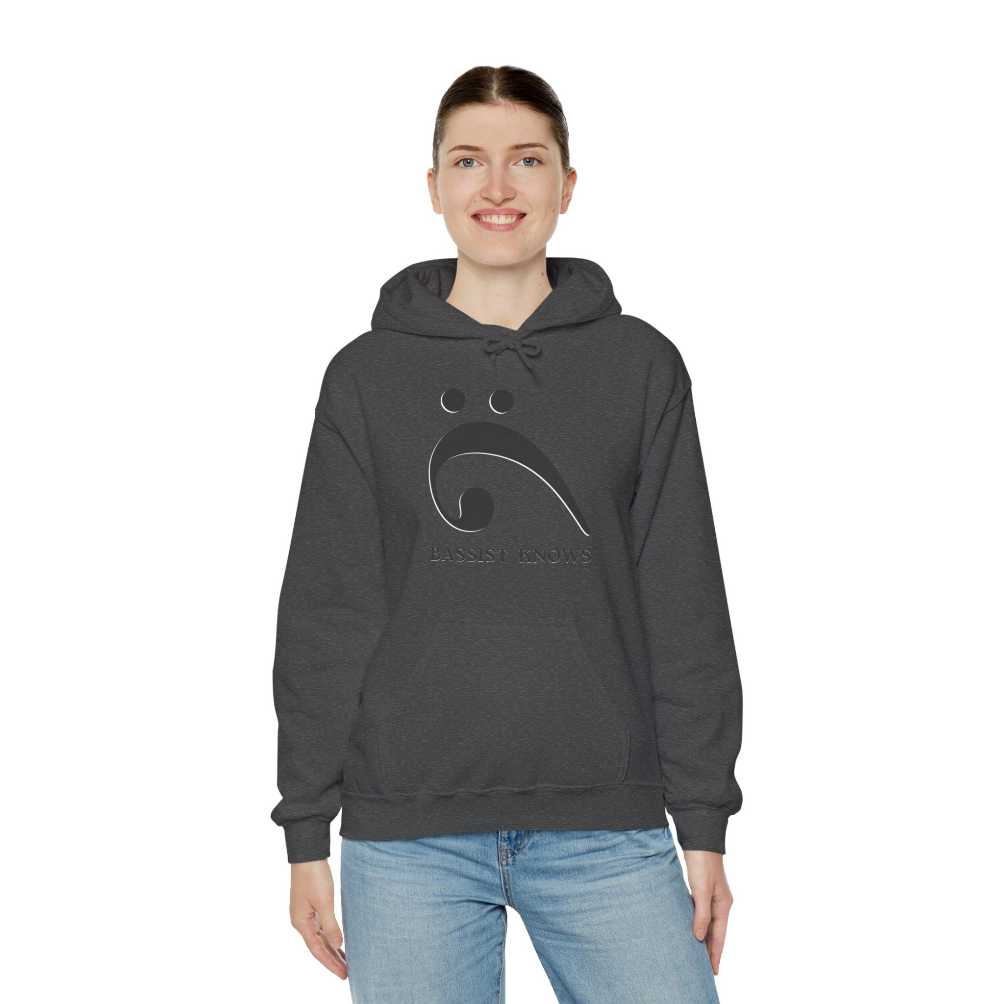 Person wearing a dark gray hoodie with a black bass clef graphic and "Bassist Knows" text on a white background