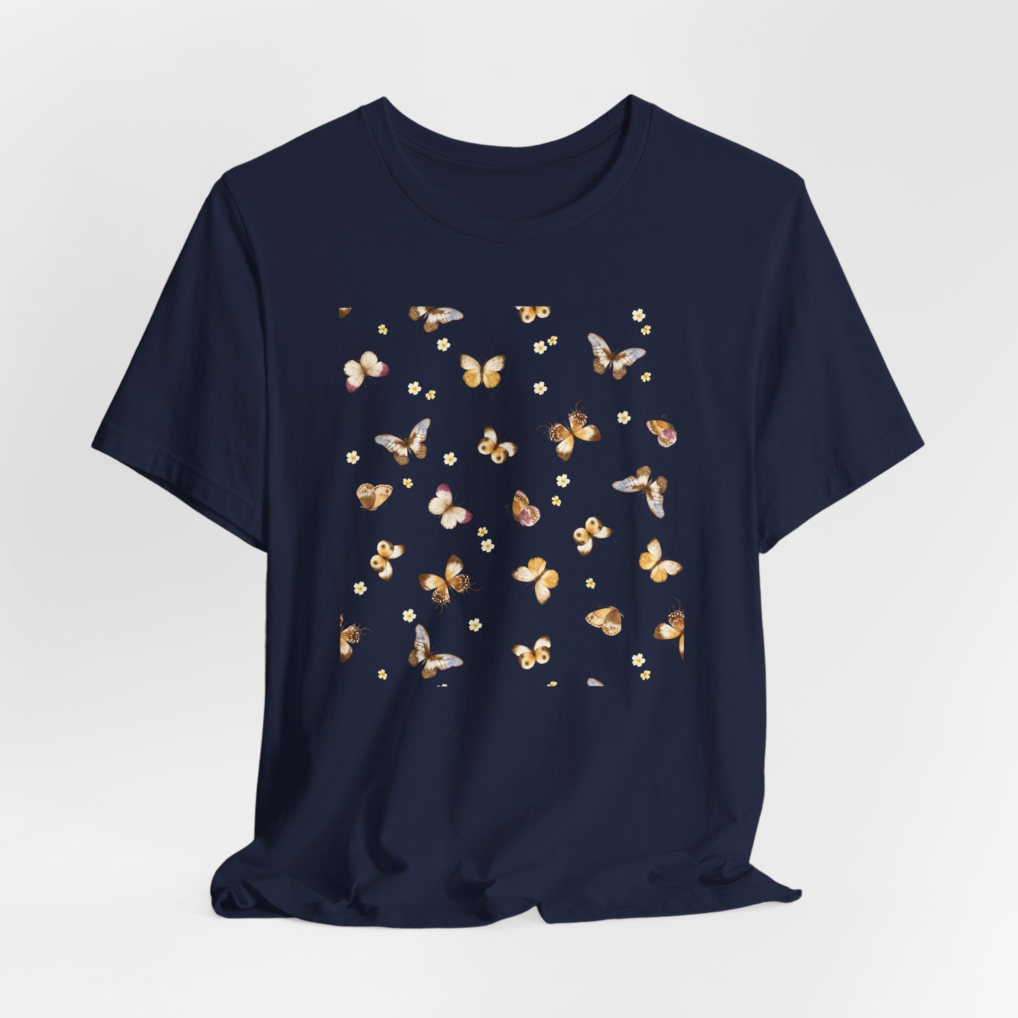 Navy blue t-shirt with butterfly pattern on a light gray background