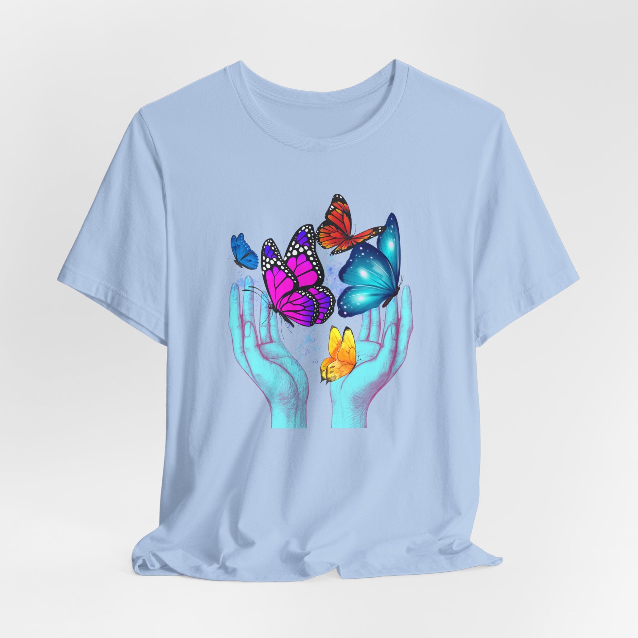 Light blue t-shirt with colorful butterfly design on a white background