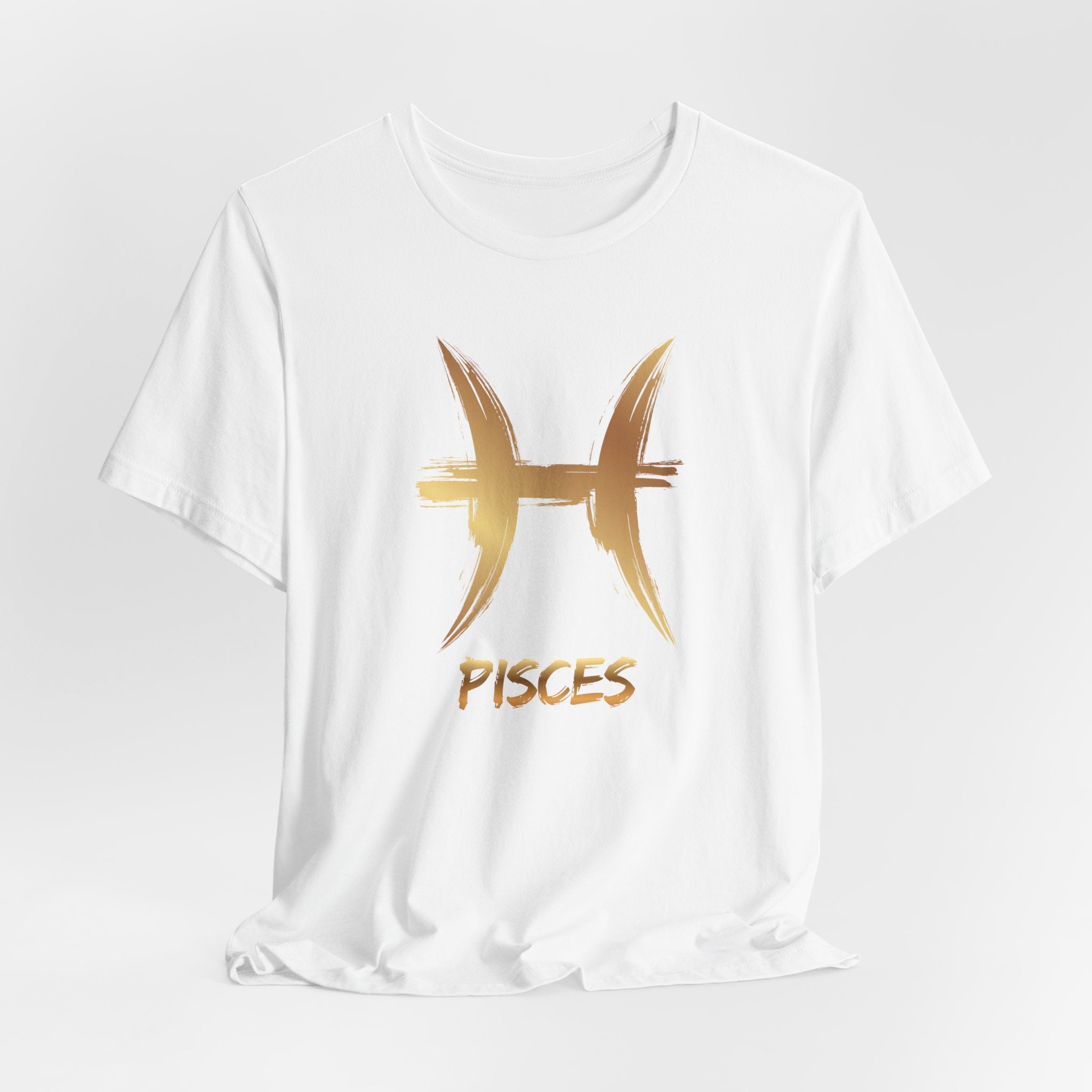 White t-shirt with gold Pisces zodiac symbol on a light gray background