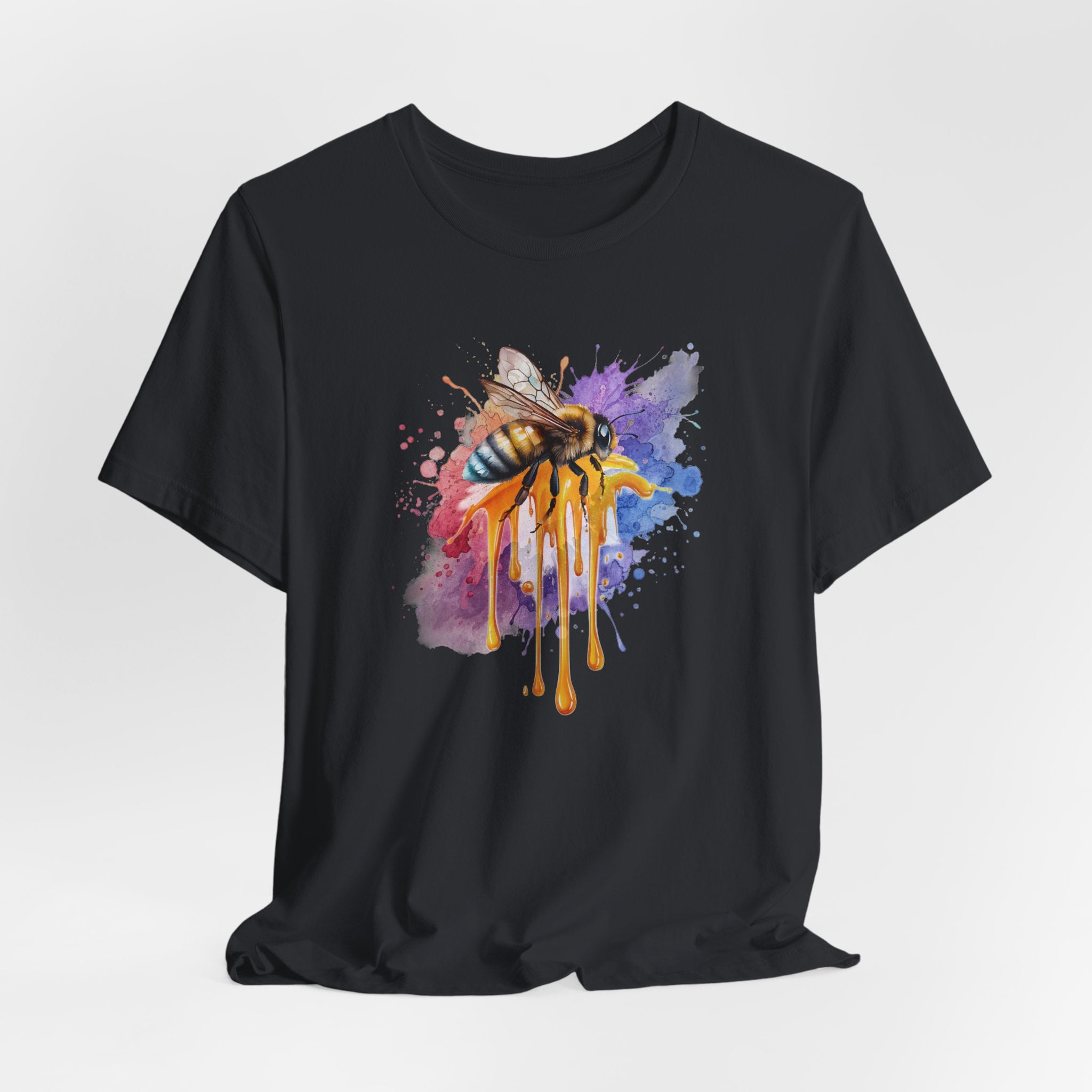Black t-shirt with a colorful bee design on a white background