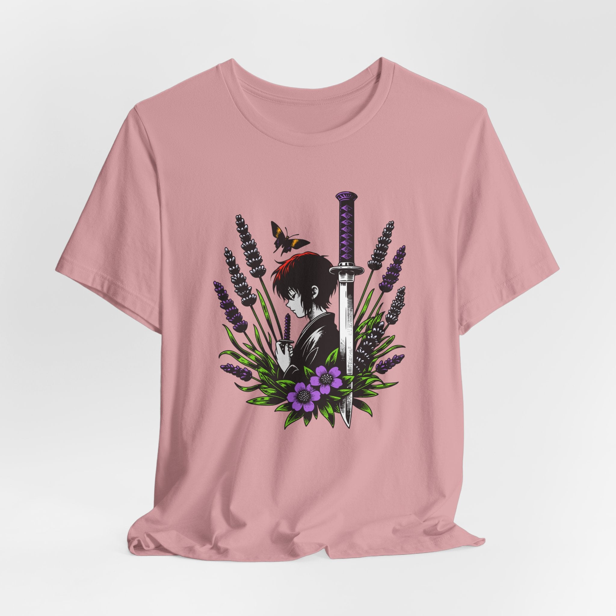 Pink t-shirt with an anime-style design featuring a character holding a sword and flowers on a light gray background.