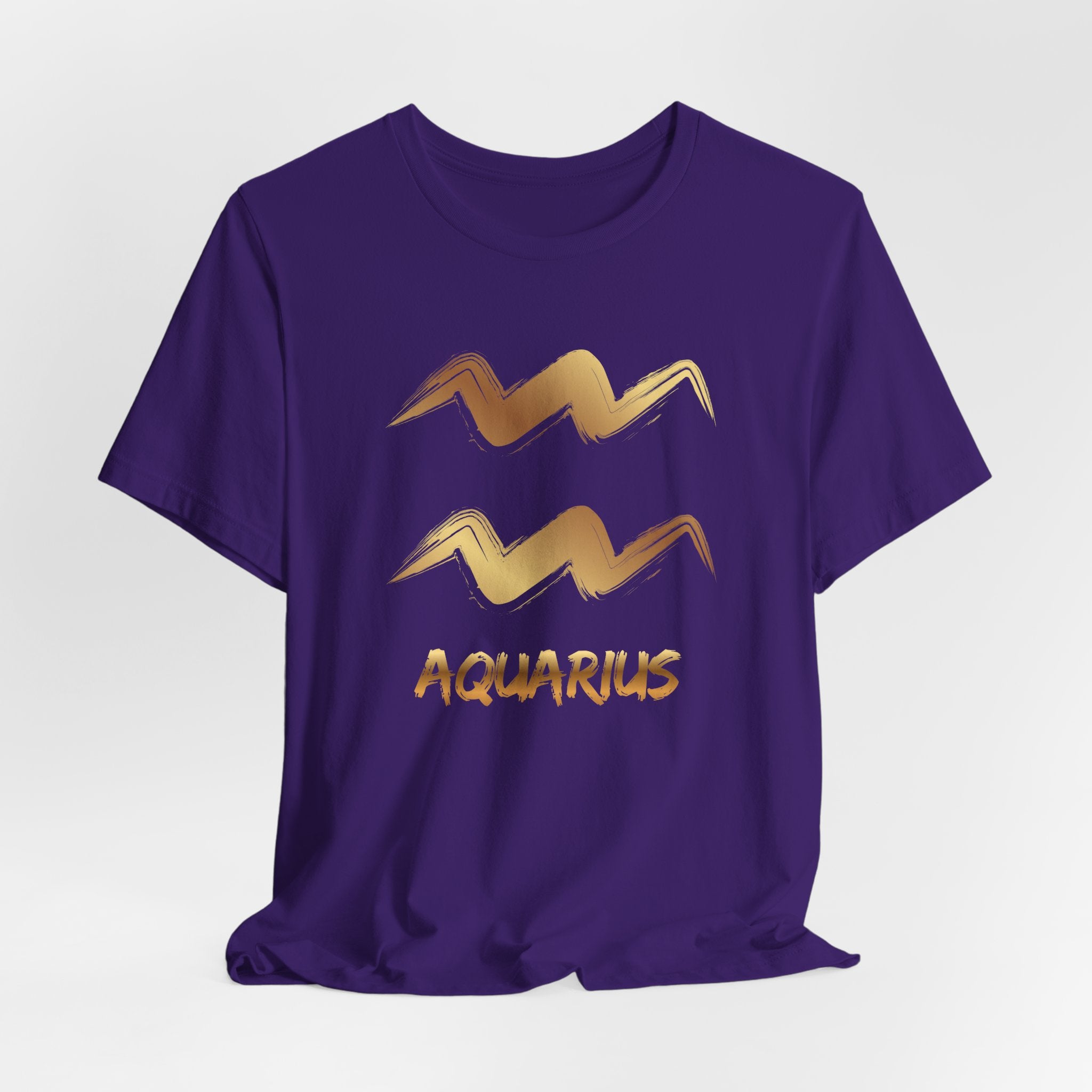 Purple t-shirt with gold Aquarius zodiac symbol on a white background