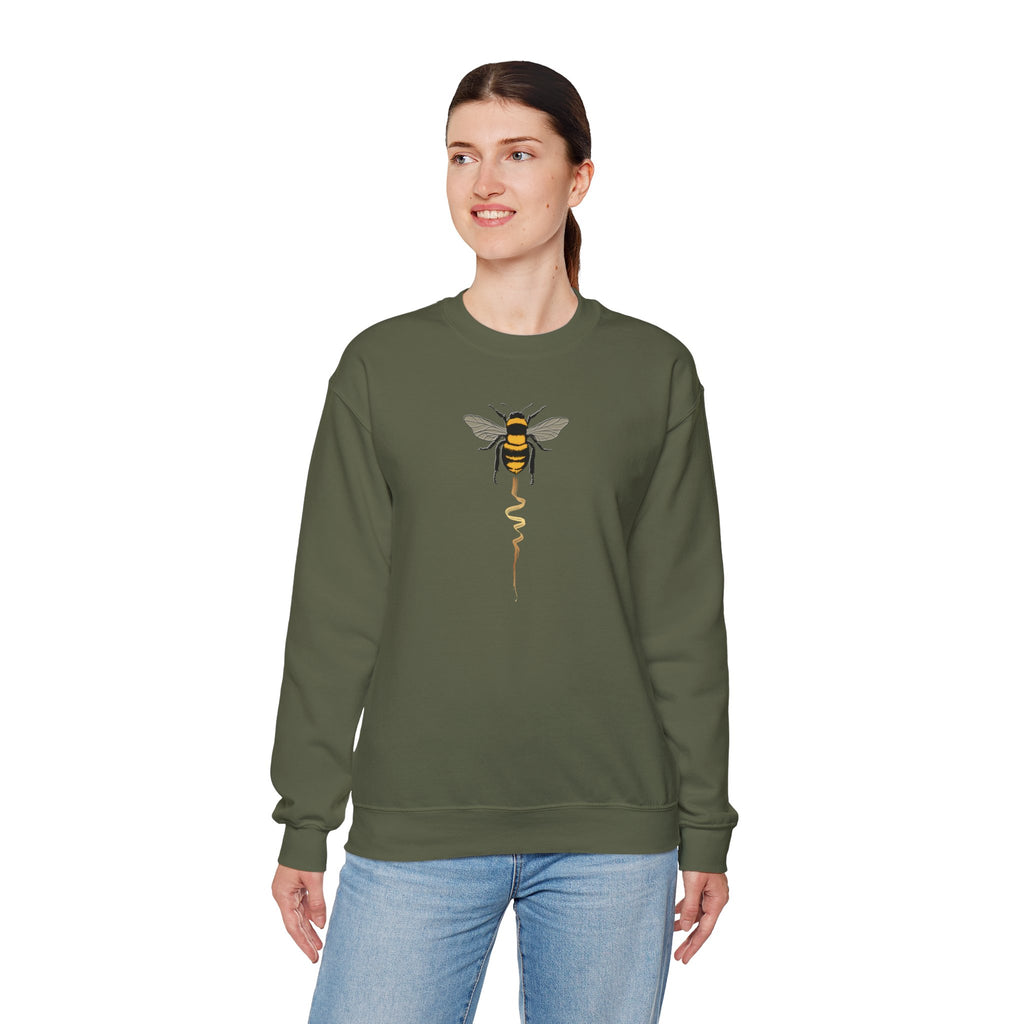 Person wearing a green sweatshirt with a bee graphic on a white background
