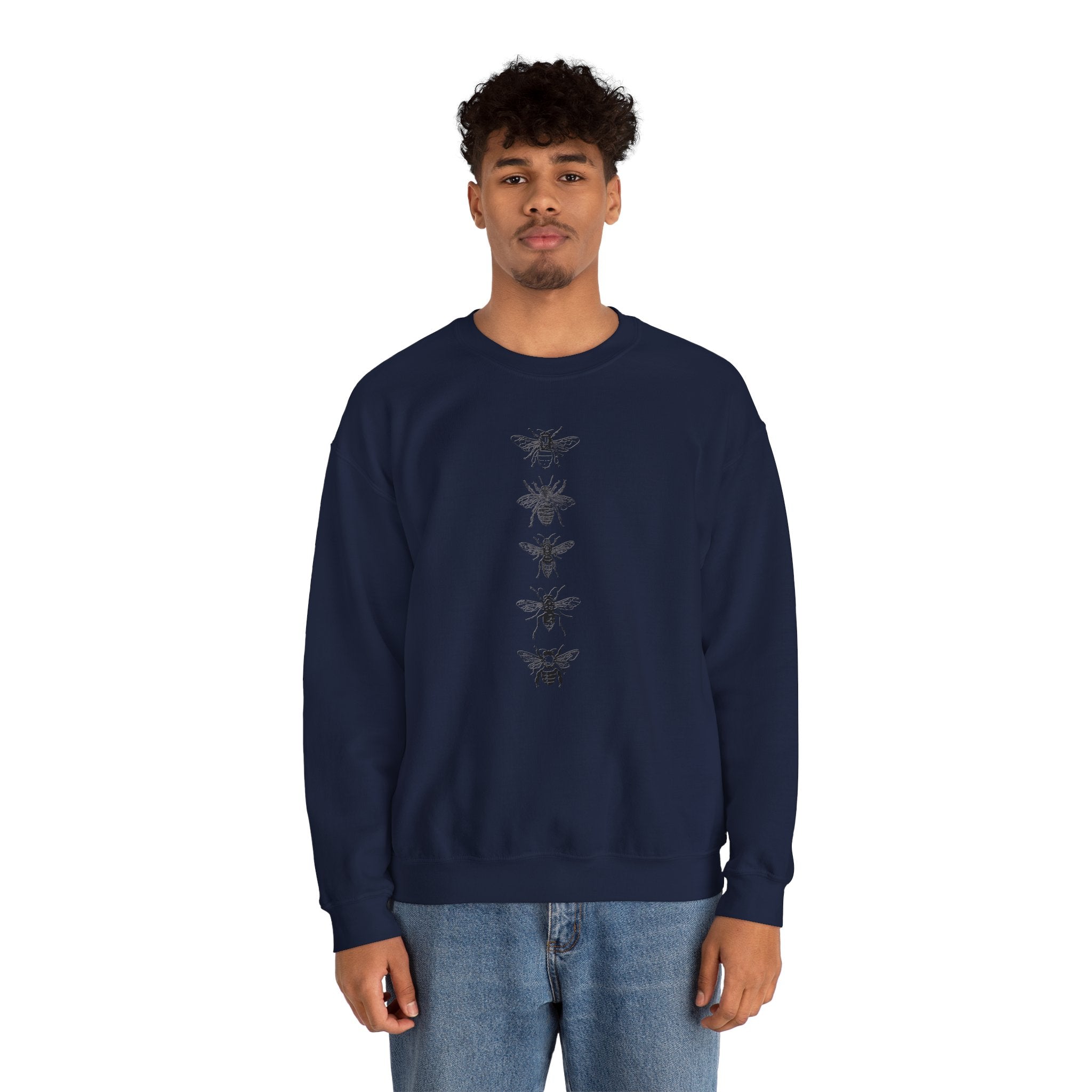 Person wearing a navy blue sweatshirt with black bee illustrations on a white background
