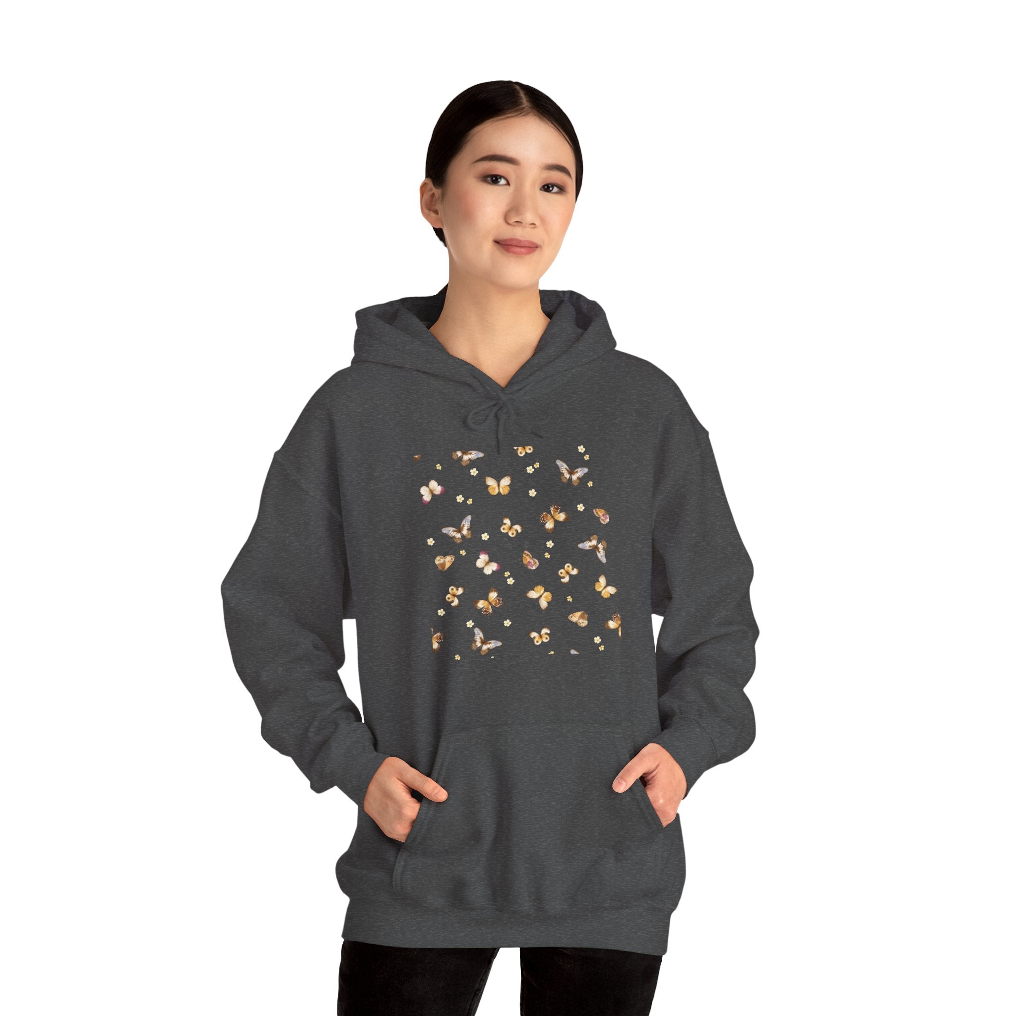 Person wearing a gray hoodie with butterfly design on a white background