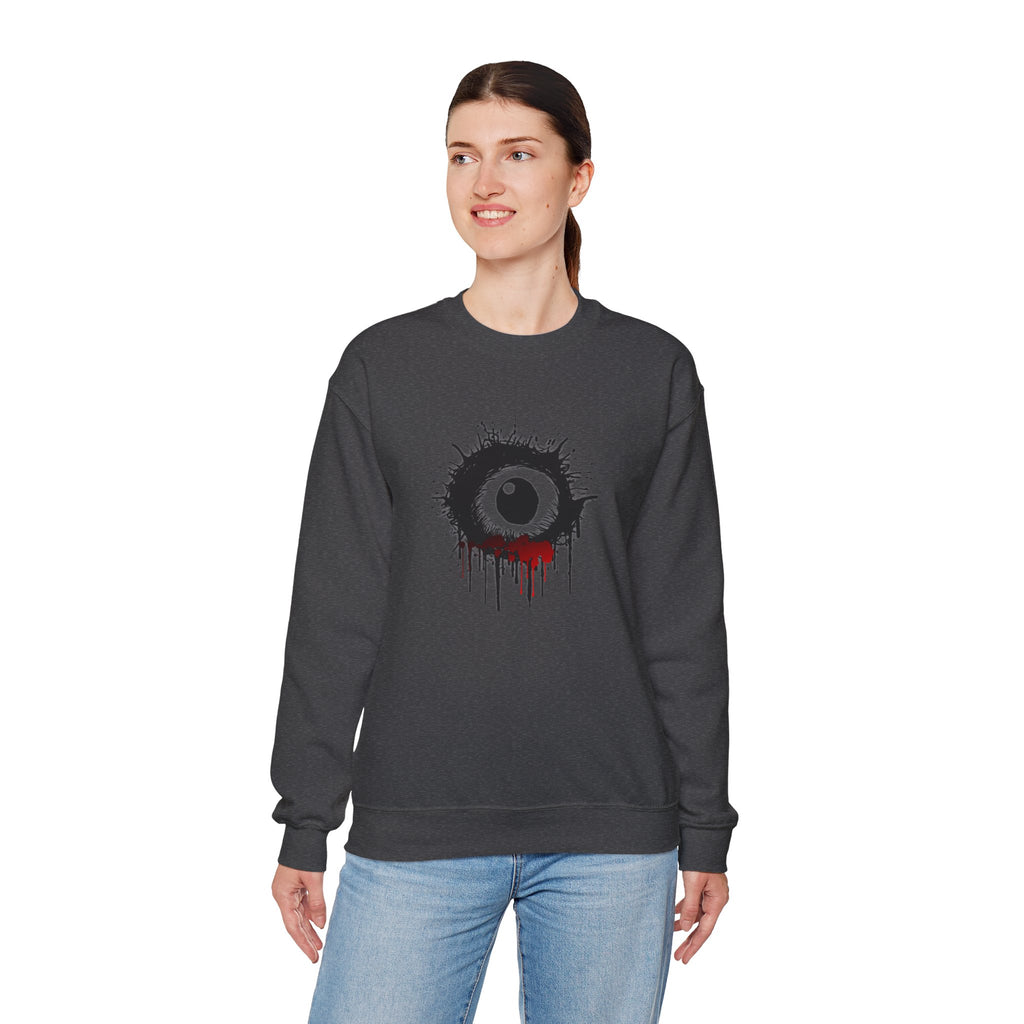 Person wearing a dark gray sweatshirt with a unique design on a white background