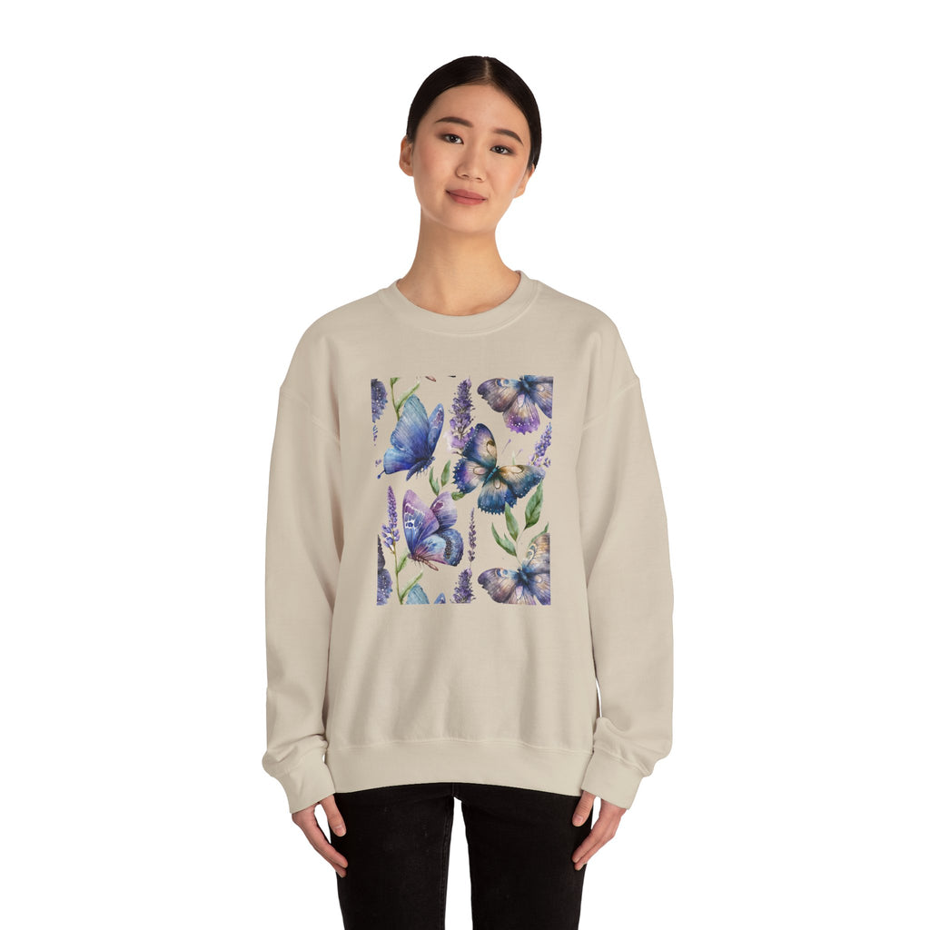 Woman wearing a beige sweatshirt with a butterfly and flower design on a white background