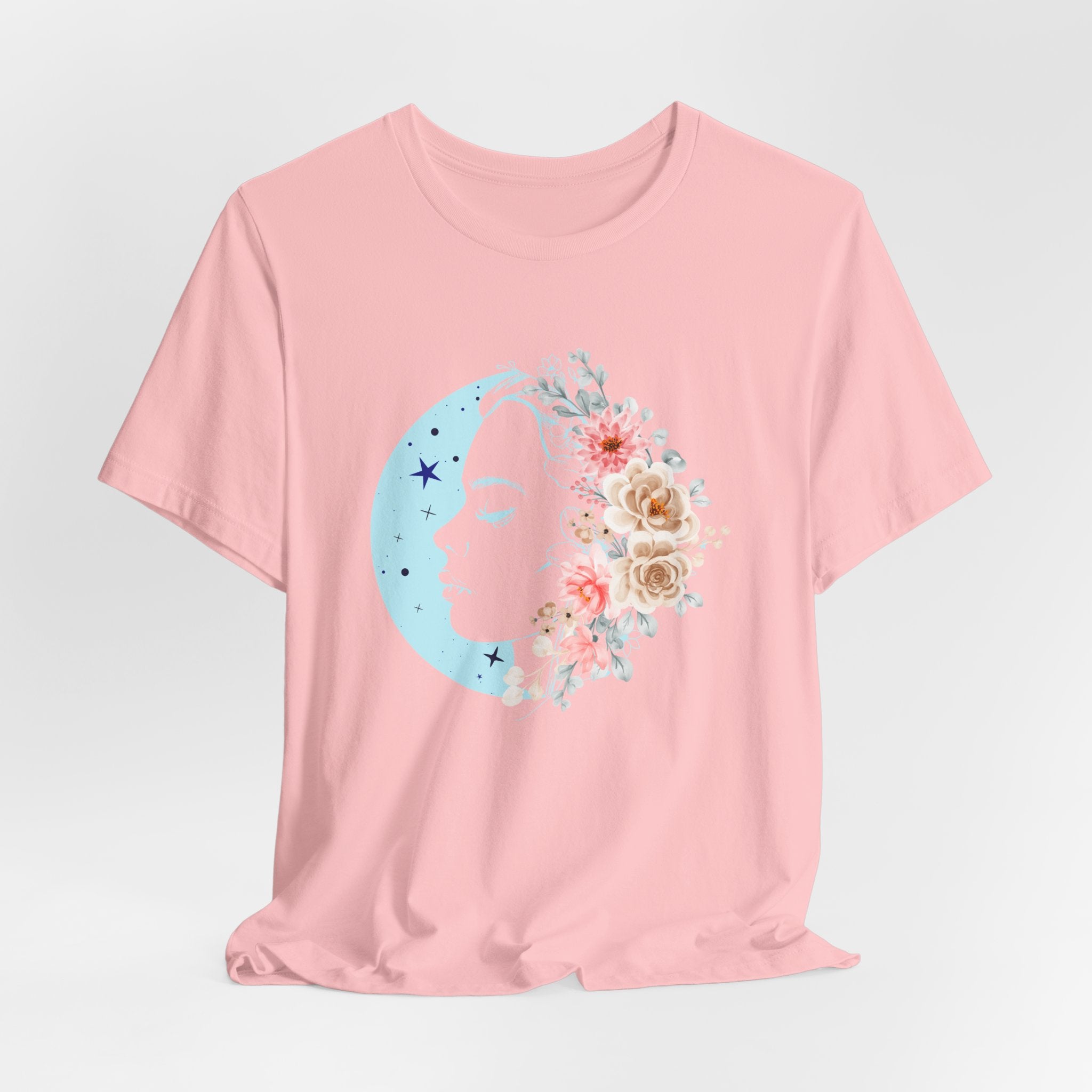 Pink t-shirt with a floral moon design on a light gray background