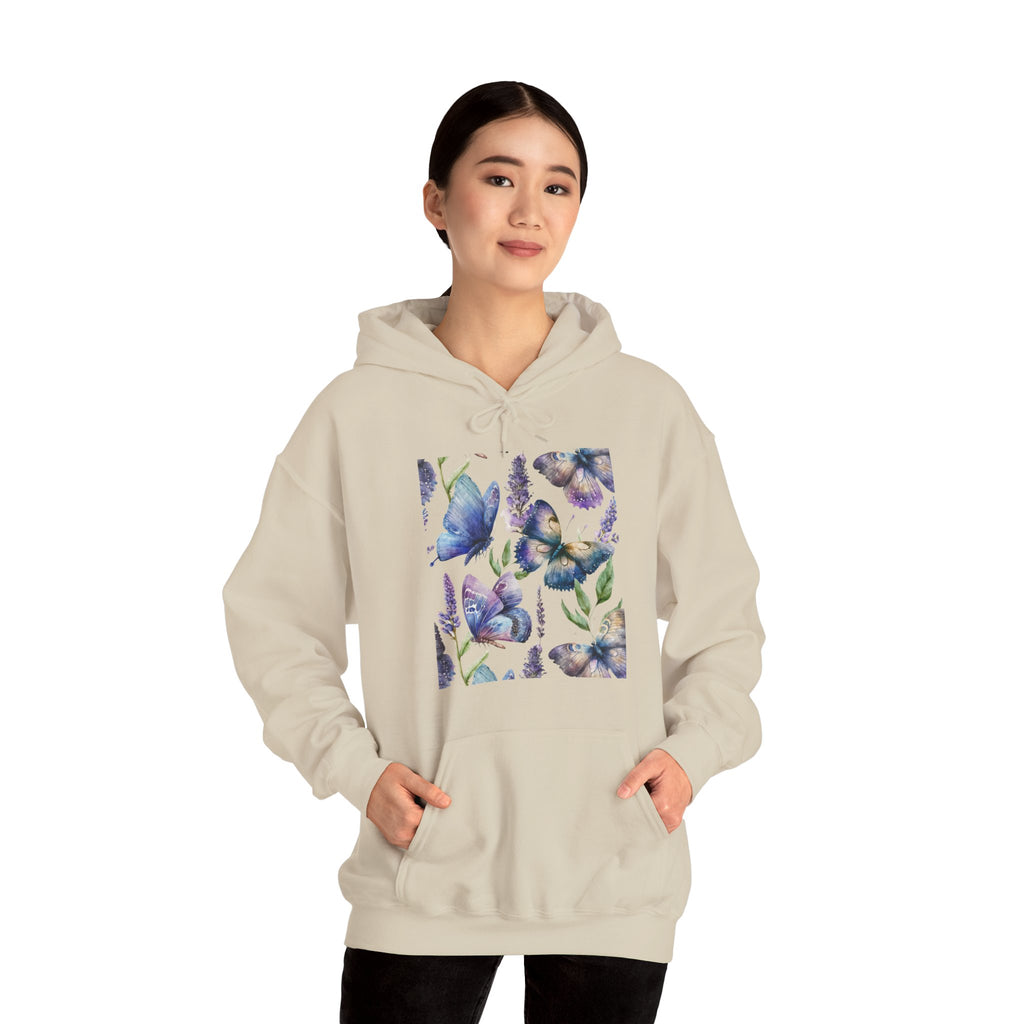 Person wearing a beige hoodie with butterfly design on a white background