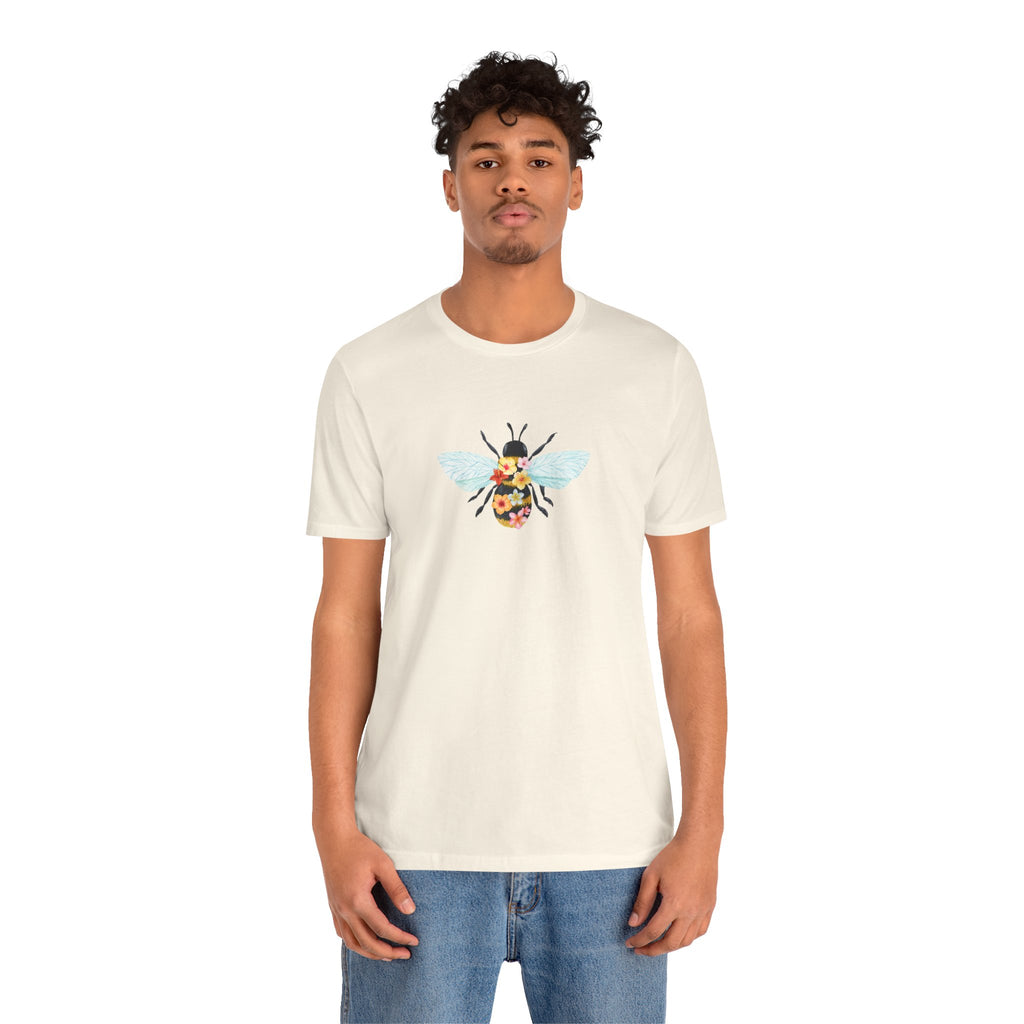 Person wearing a white t-shirt with a graphic design on a white background