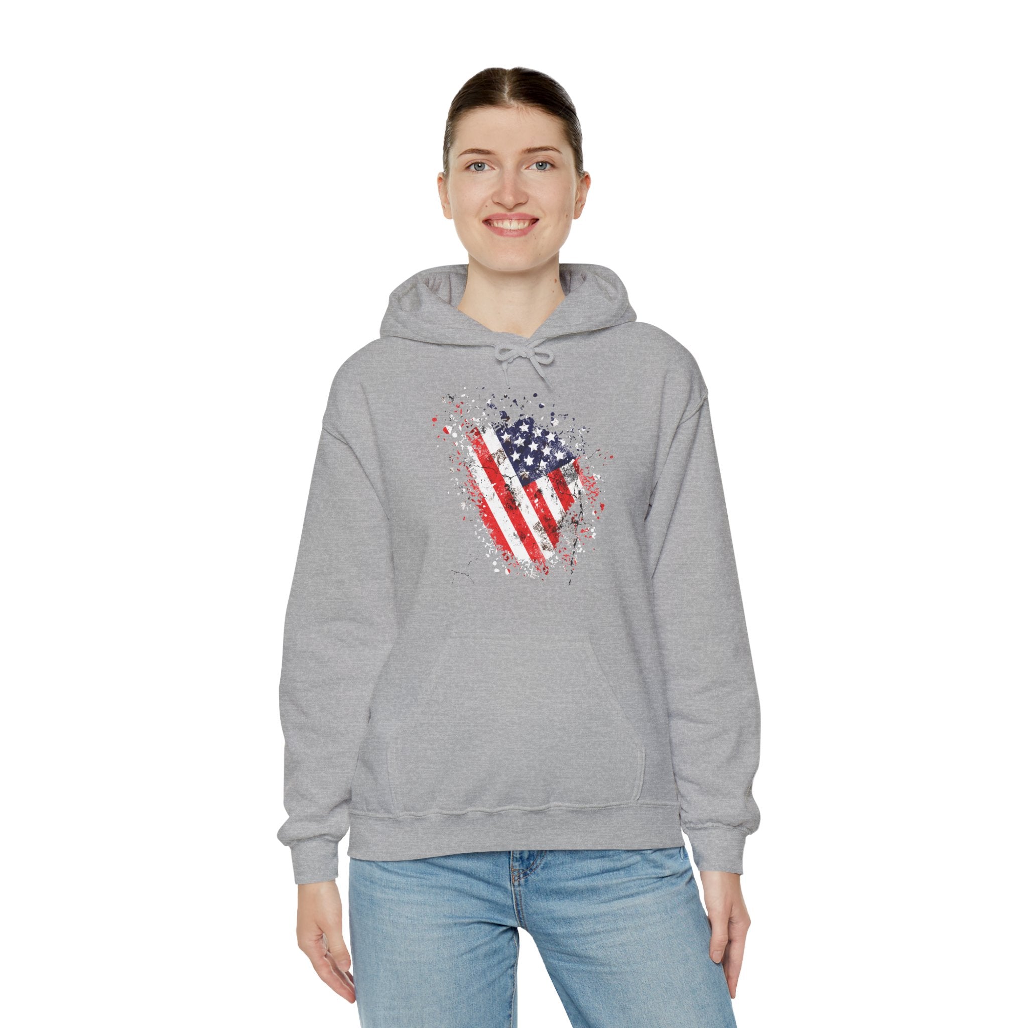 Person wearing a gray hoodie with an American flag design on a white background