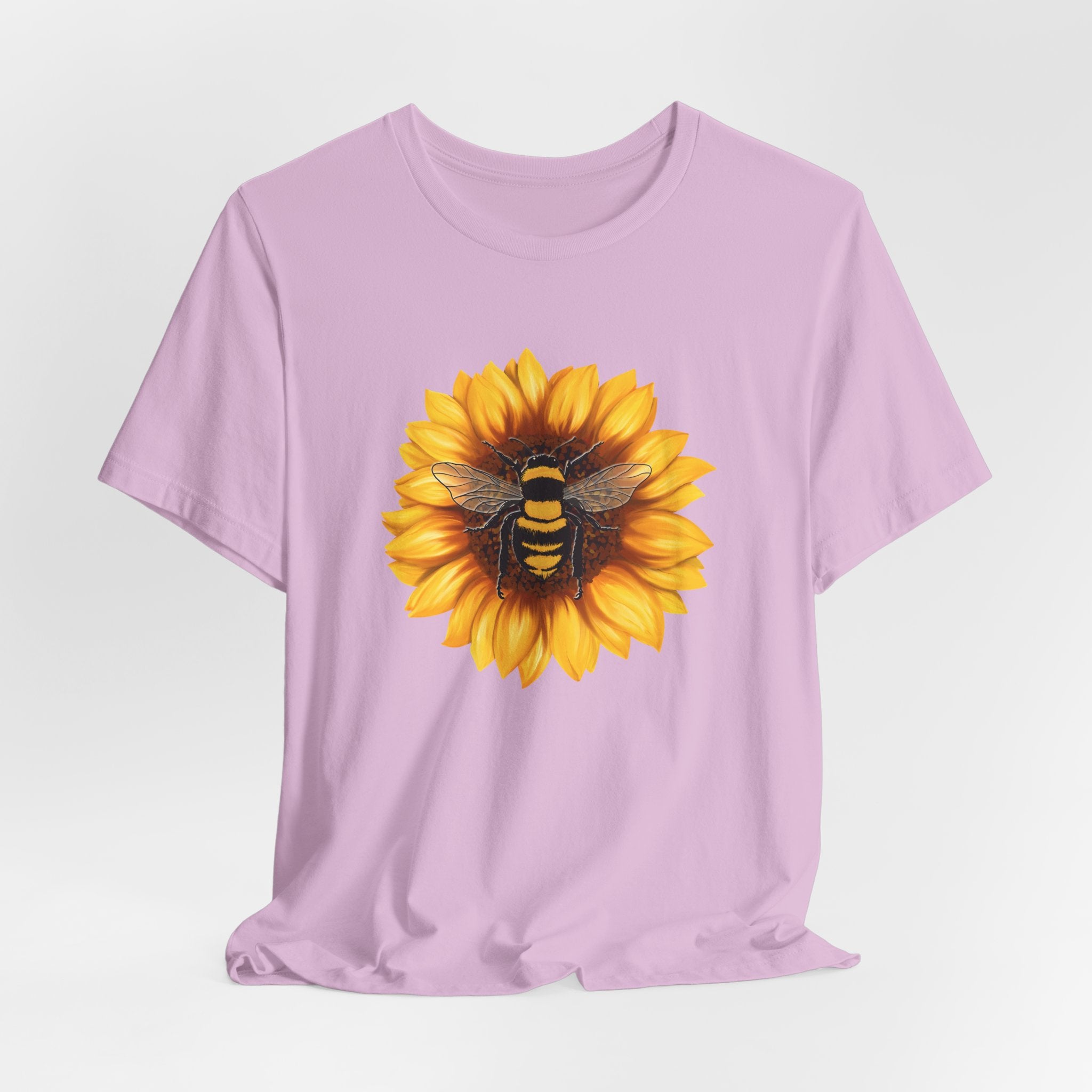 Lavender t-shirt with a sunflower and bee design on a white background