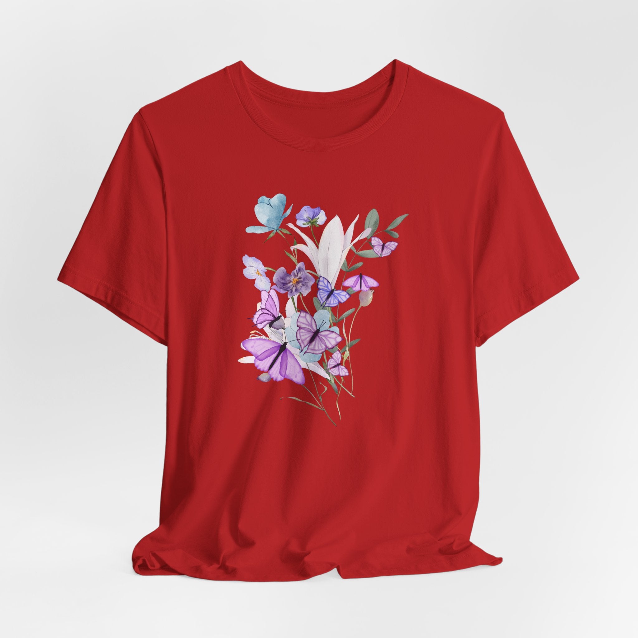 Red t-shirt with floral design on a white background