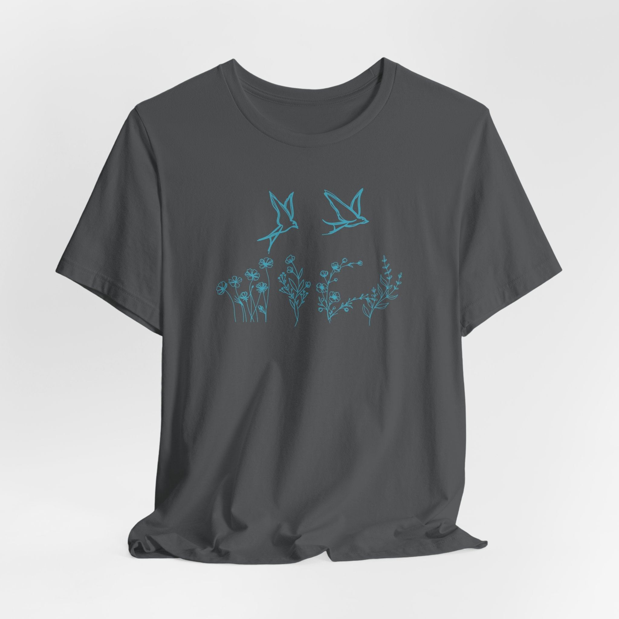 Gray t-shirt with blue floral and bird design on a white background