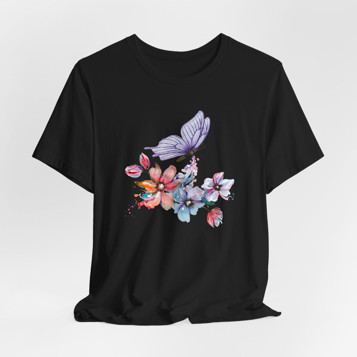 Black t-shirt with colorful butterfly and floral design on a white background