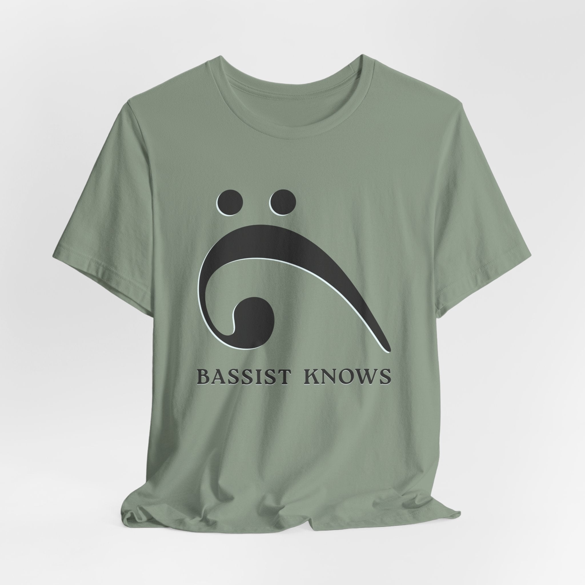 Green t-shirt with black bass clef and 'Bassist Knows' text on a light gray background
