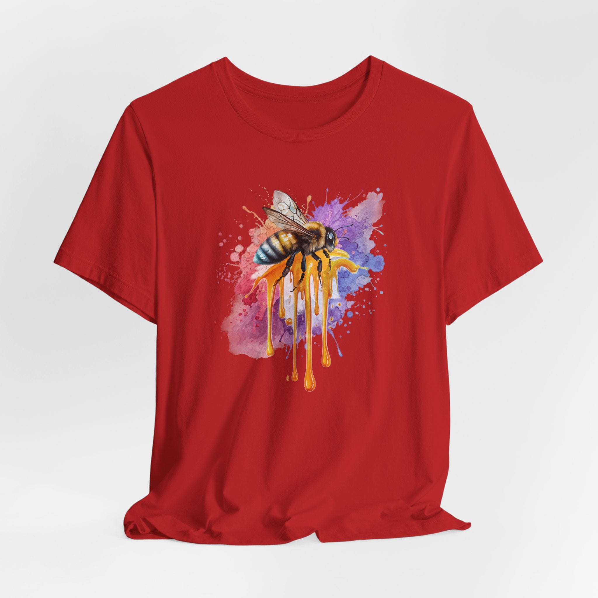 Red t-shirt with a colorful bee design on a white background