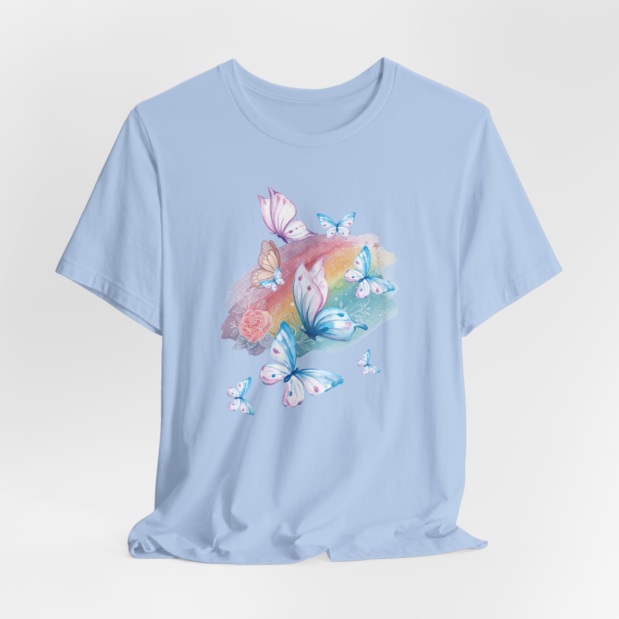 Light blue t-shirt with butterfly and floral design on a light gray background