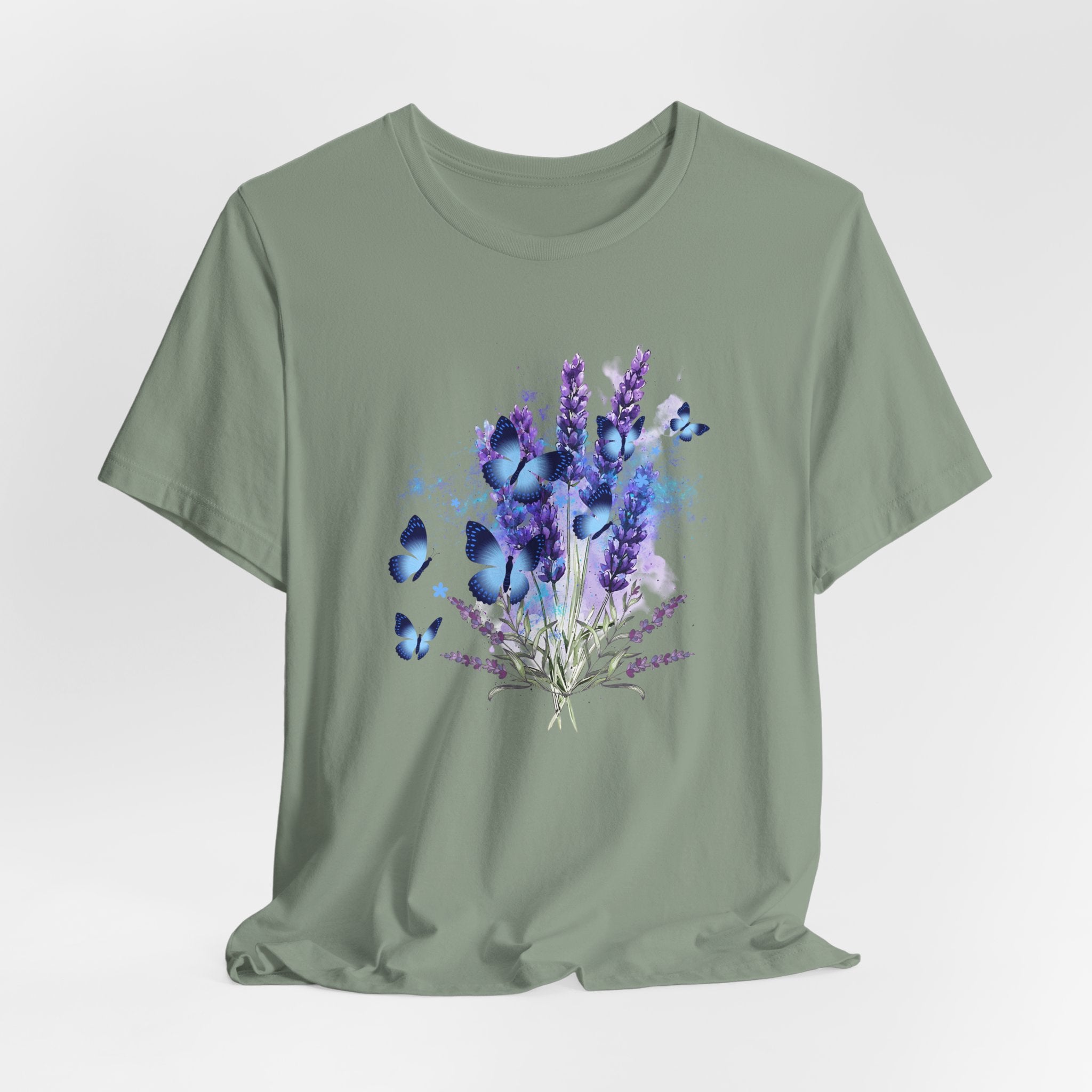 Green t-shirt with a design of lavender flowers and butterflies on a light gray background