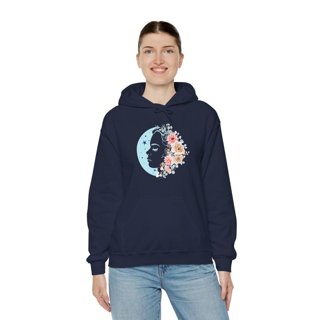 Person wearing a navy blue hoodie with floral face moon design on a white background