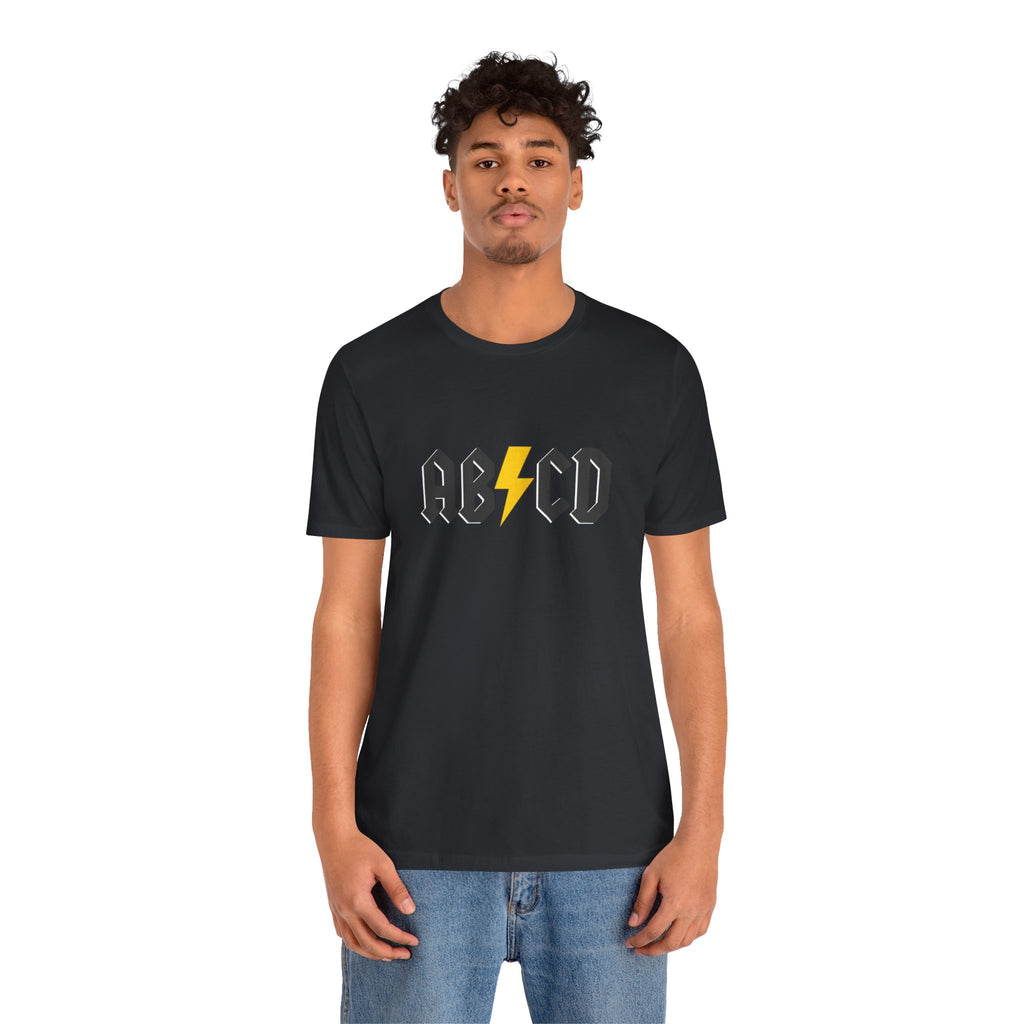 Person wearing a blackt-shirt with "ABCD" text and lightning graphics on a white background