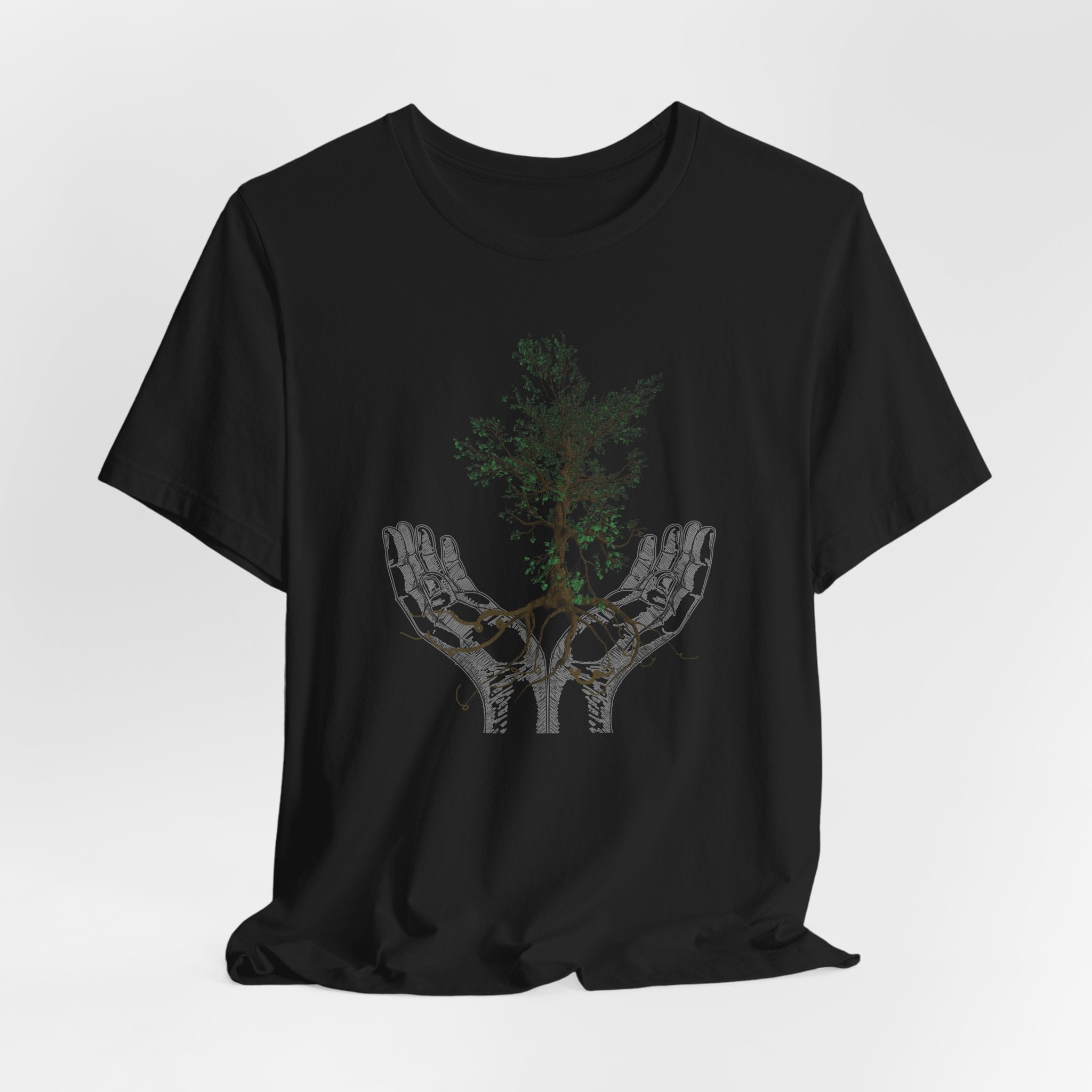 Black t-shirt with a graphic design of hands holding a tree on a white background