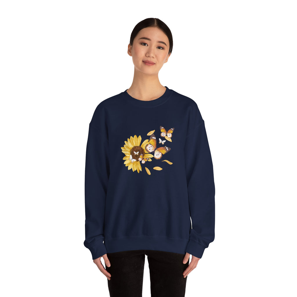 Navy blue sweatshirt with sunflower design worn by a model on a white background