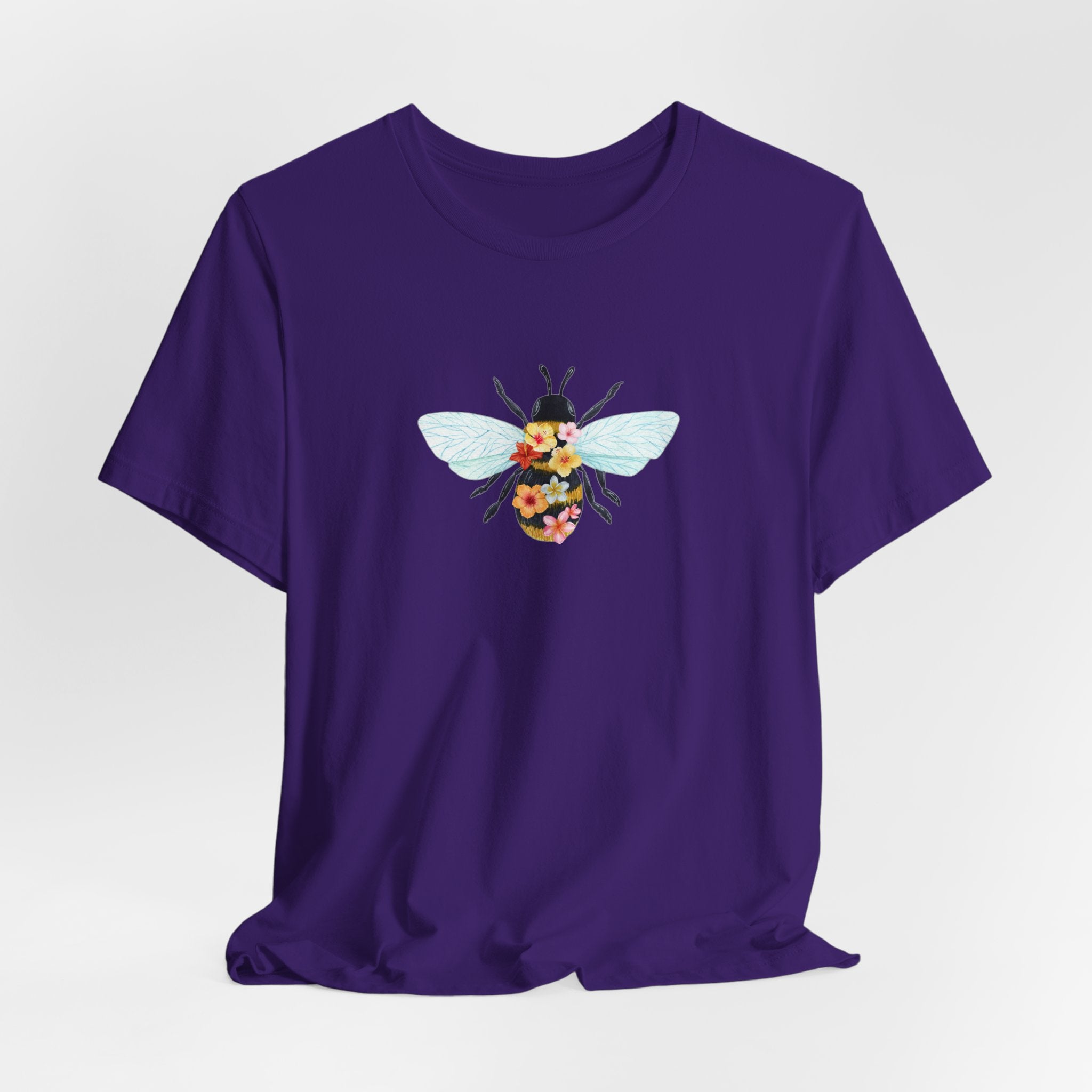 Black t-shirt with colorful text and graphics on a white background
