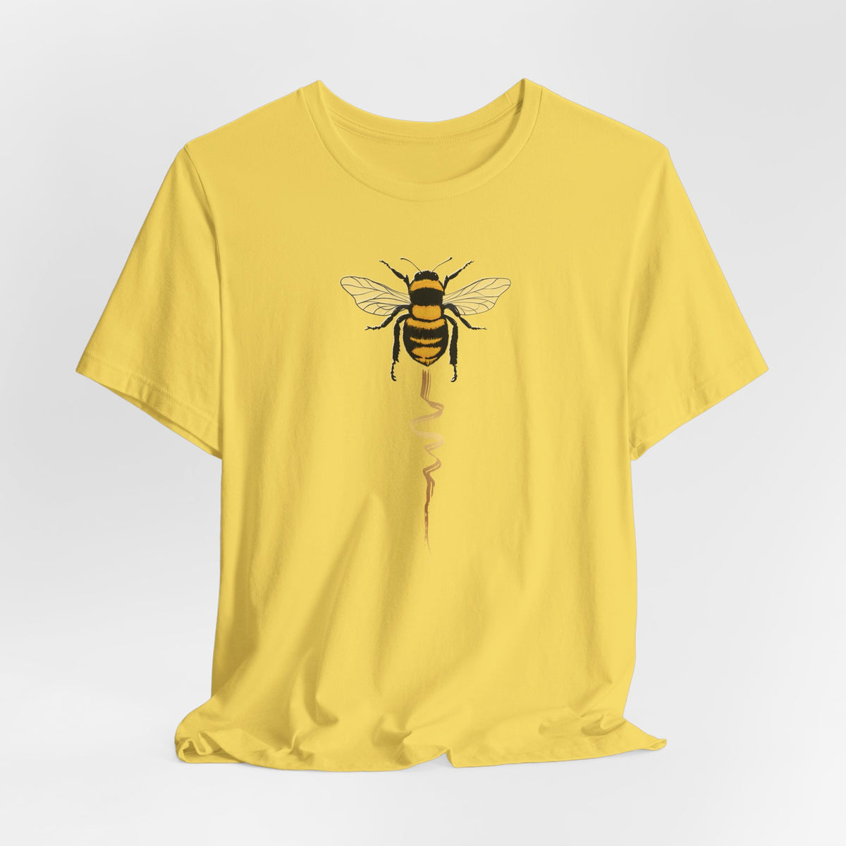 Yellow t-shirt with a bee design on a white background