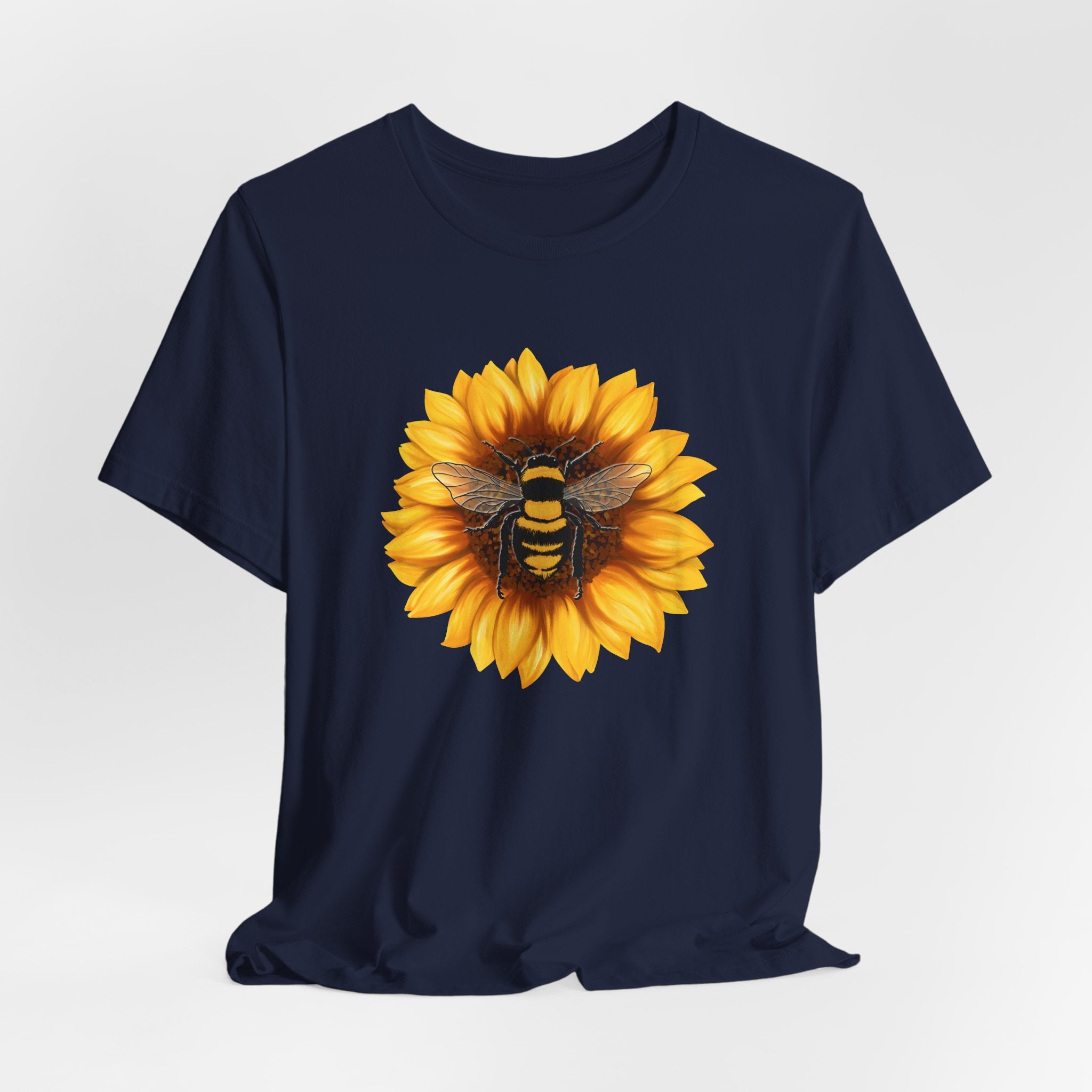 Navy blue t-shirt with a sunflower and bee design on a white background