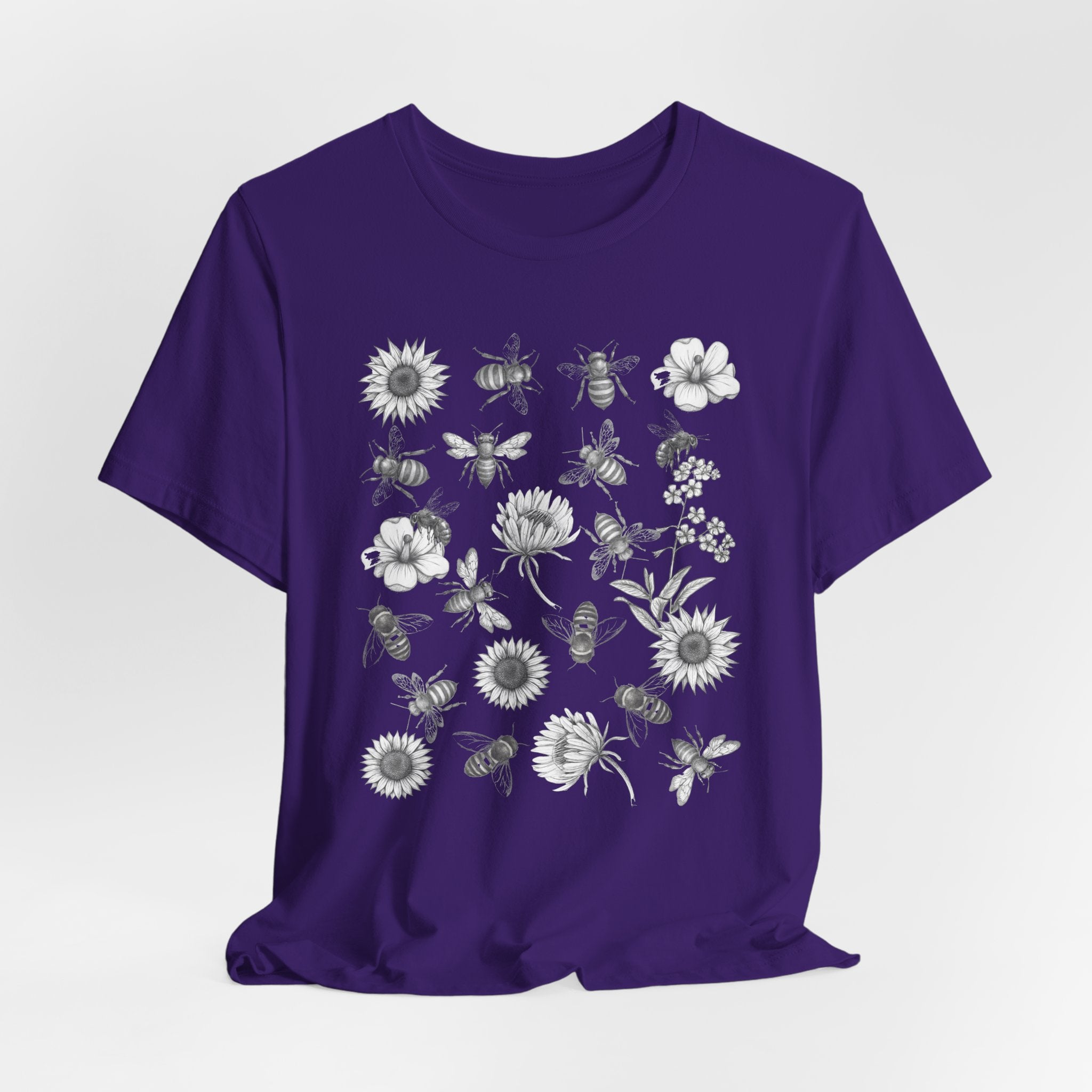 Purple t-shirt with white graphic design on a light gray background