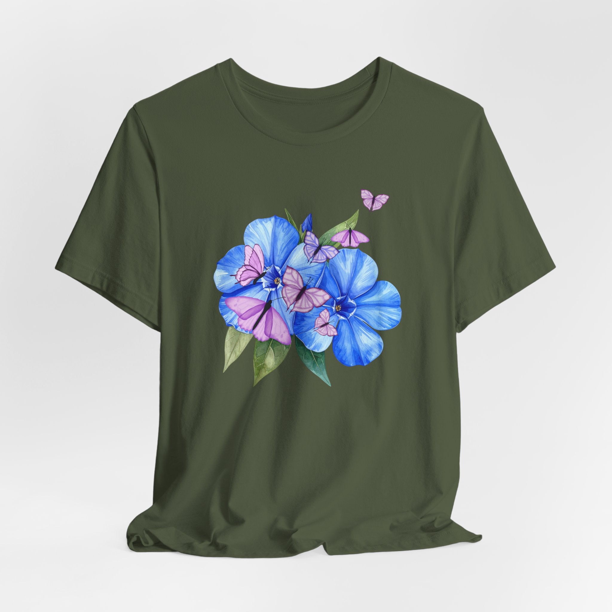 Green t-shirt with blue floral design on a light gray background