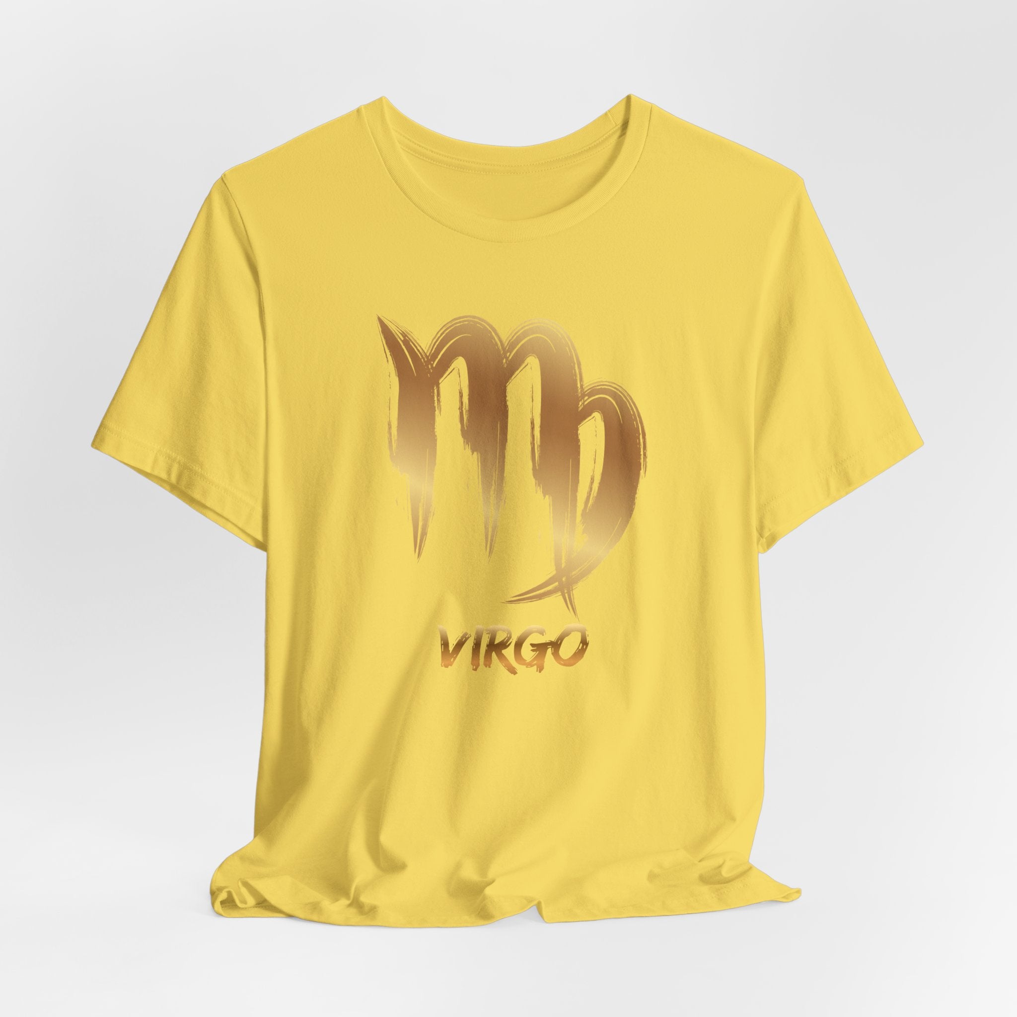 Yellow t-shirt with gold 'Virgo' design on a light gray background