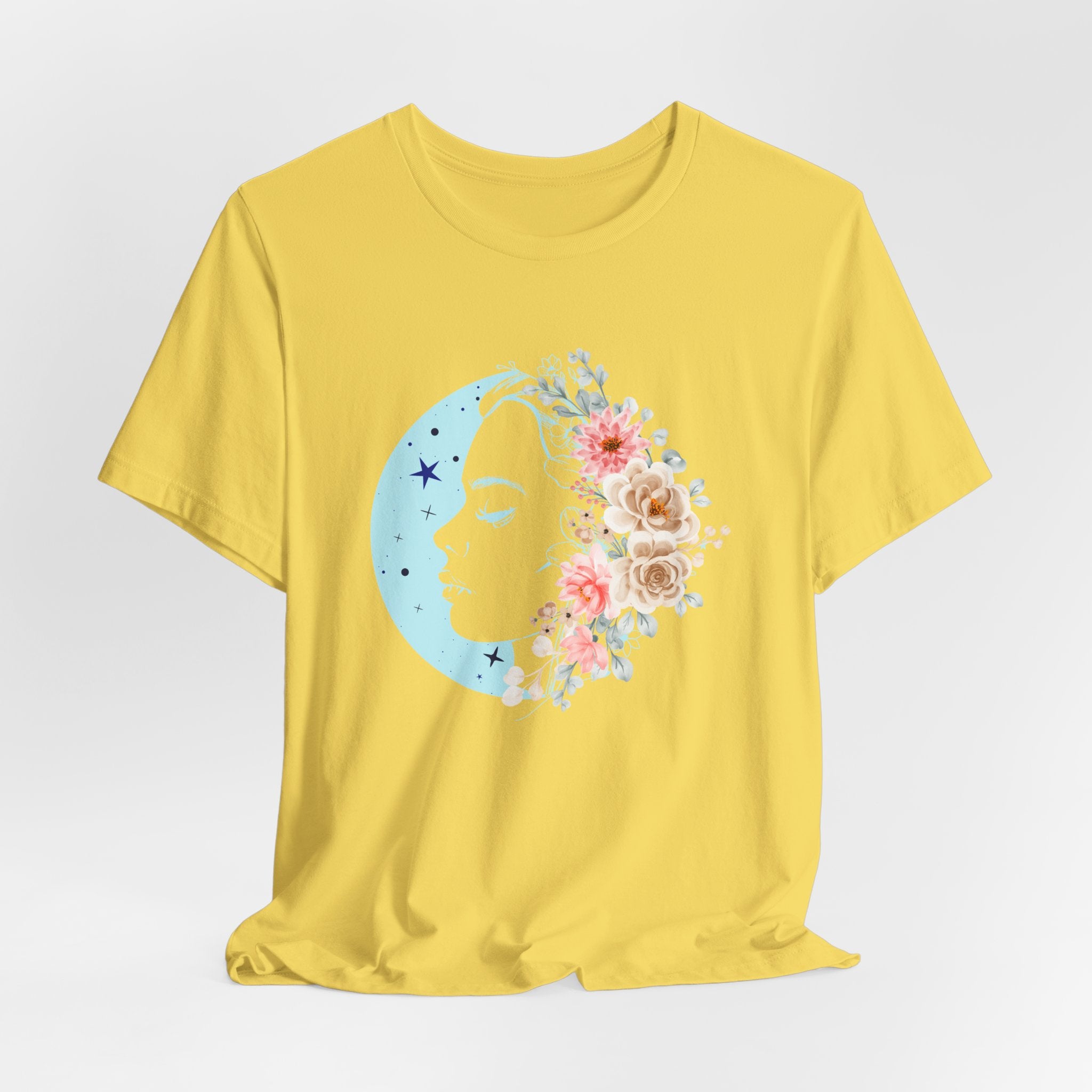 Yellow t-shirt with a floral crescent moon design on a white background