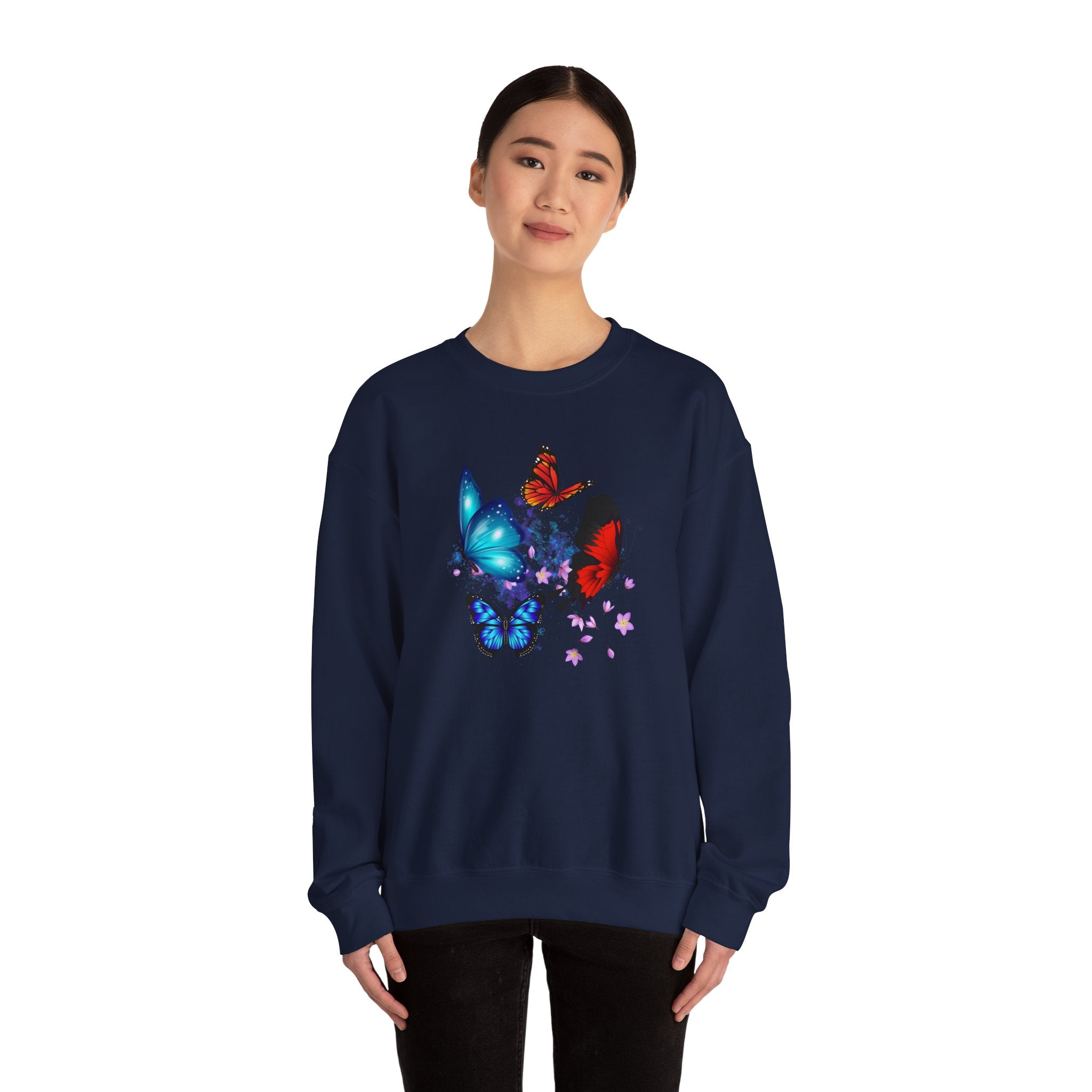 Person wearing a navy blue sweatshirt with colorful butterfly design on a white background