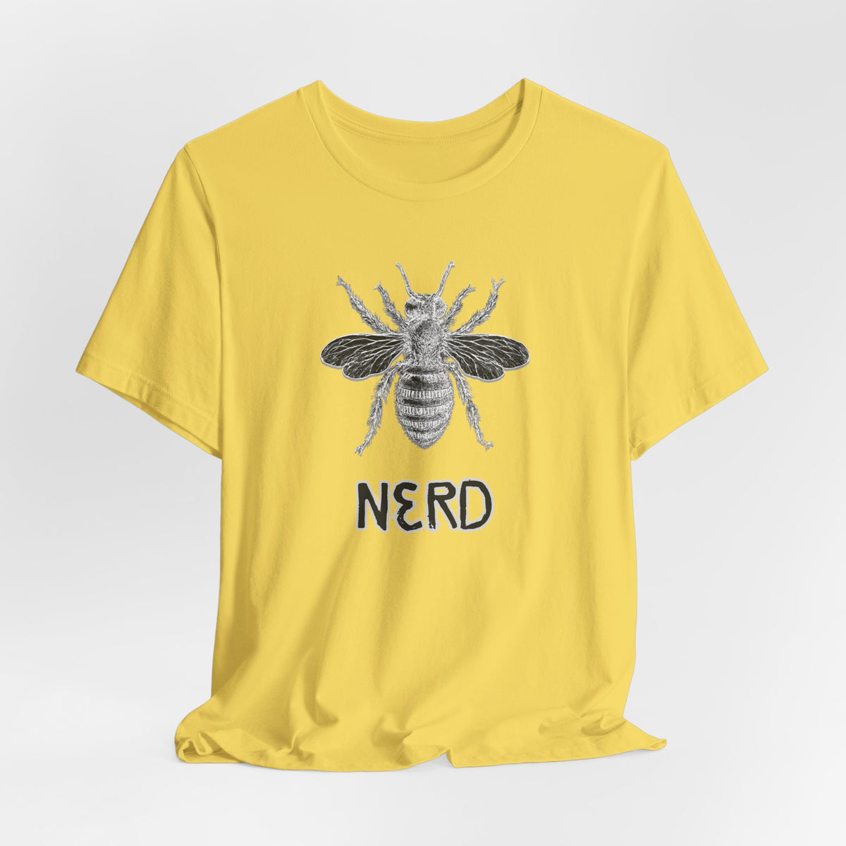 Yellow t-shirt with a bee graphic and 'NERD' text on a light gray background