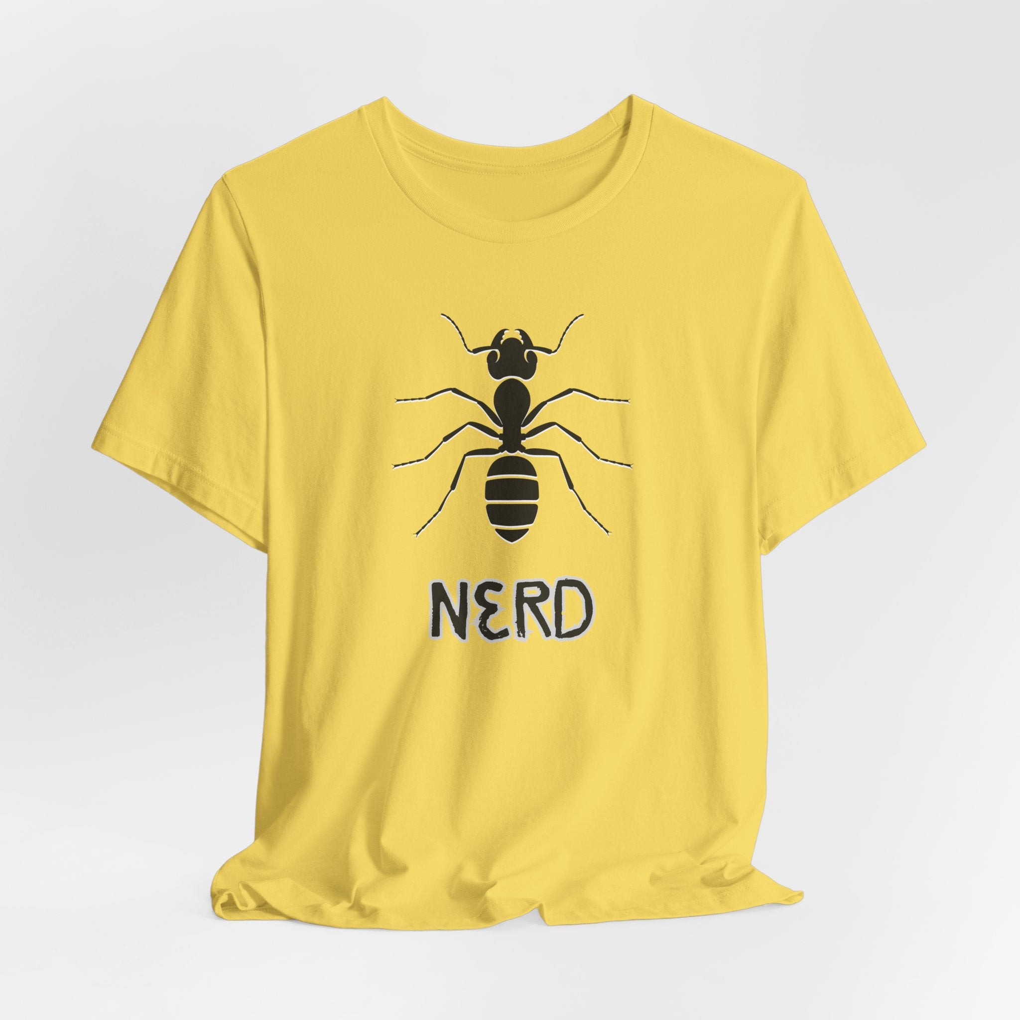 Yellow t-shirt with an ant design and text nerd on a light gray background