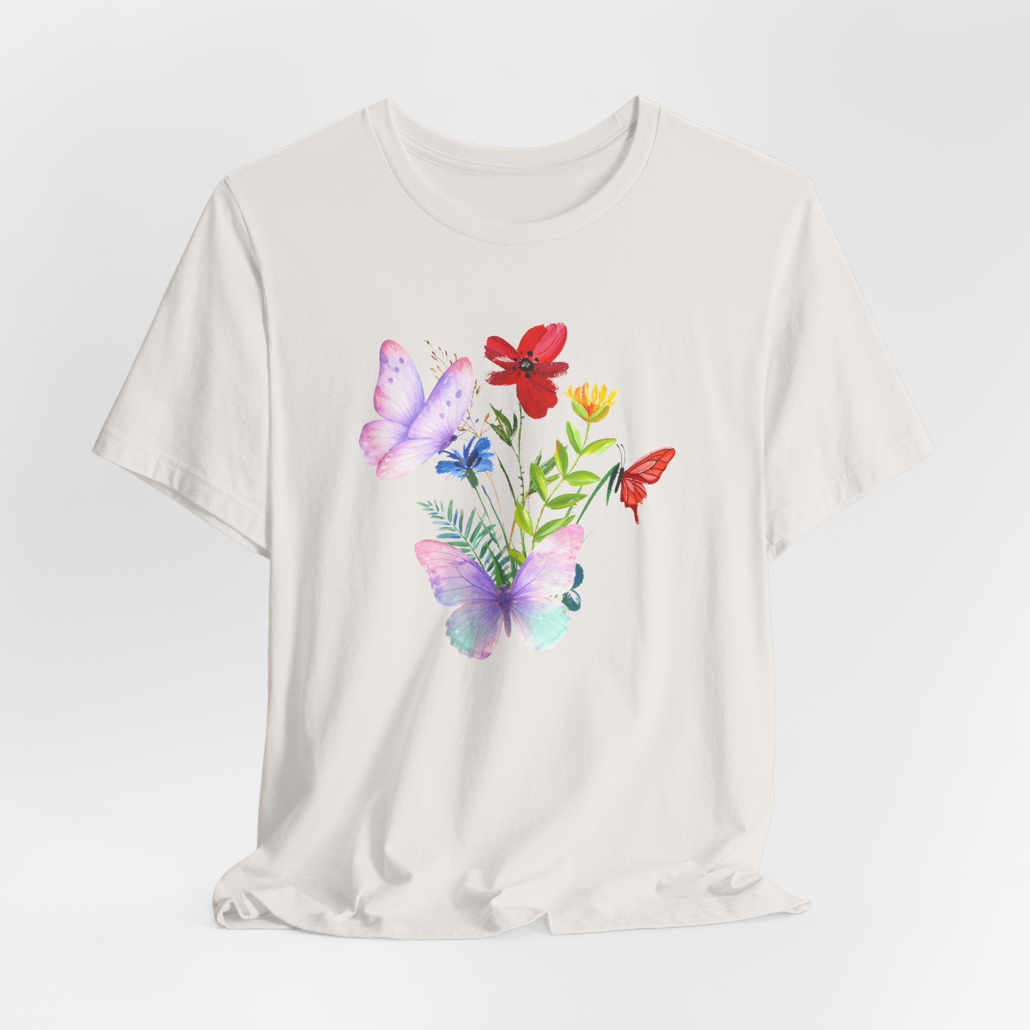 White t-shirt with colorful butterfly and flower design on a white background