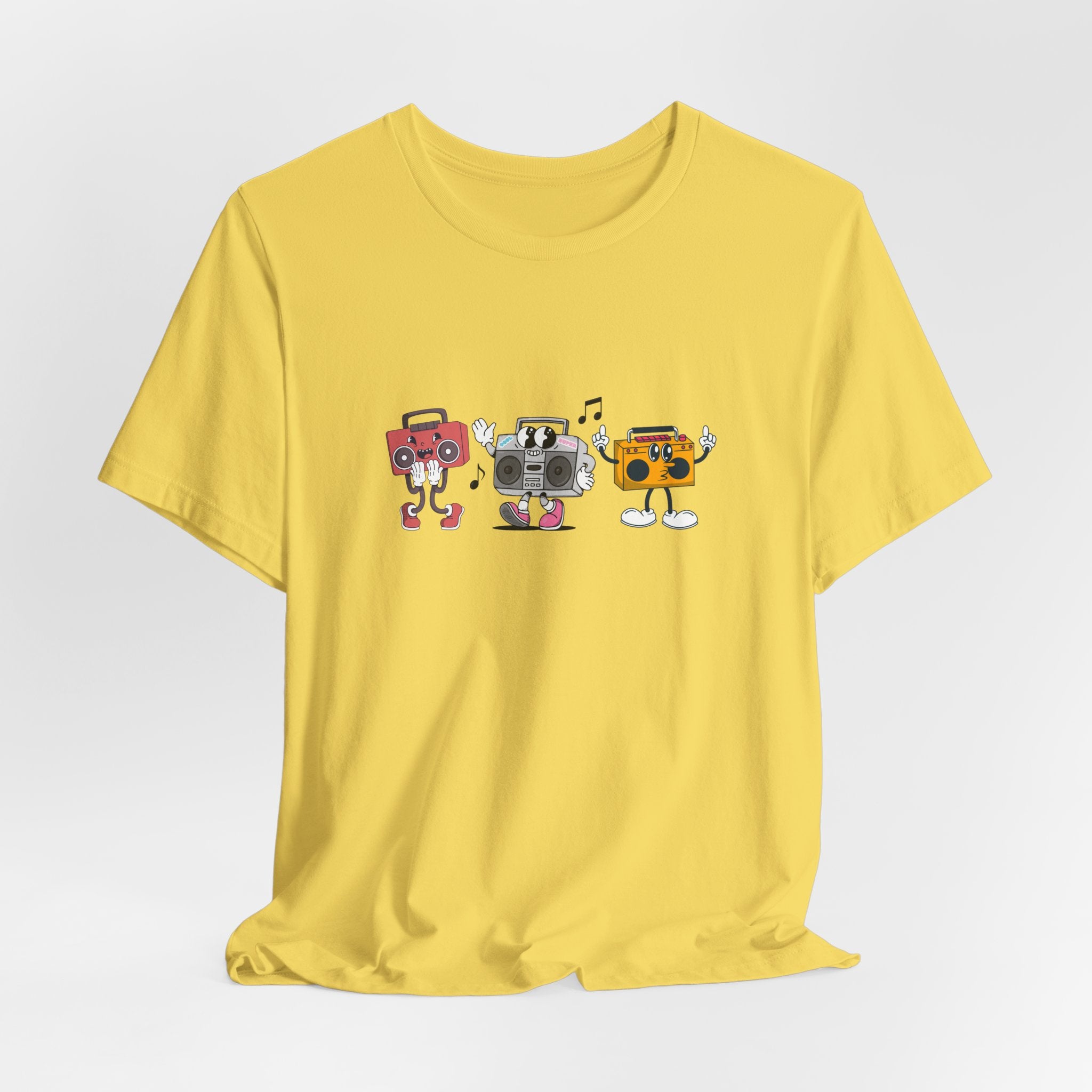 Yellow t-shirt with cartoon boombox design on a light gray background